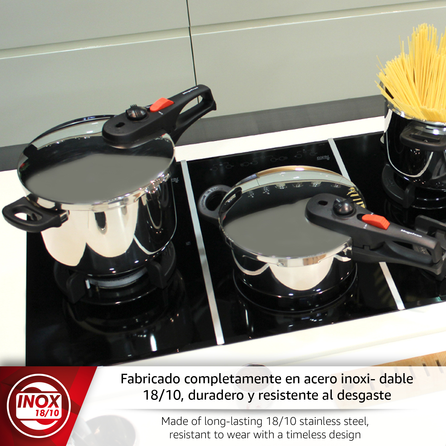 Dos ollas de acero inoxidable con asas rojas en una vitrocerámica, con pasta al lado.