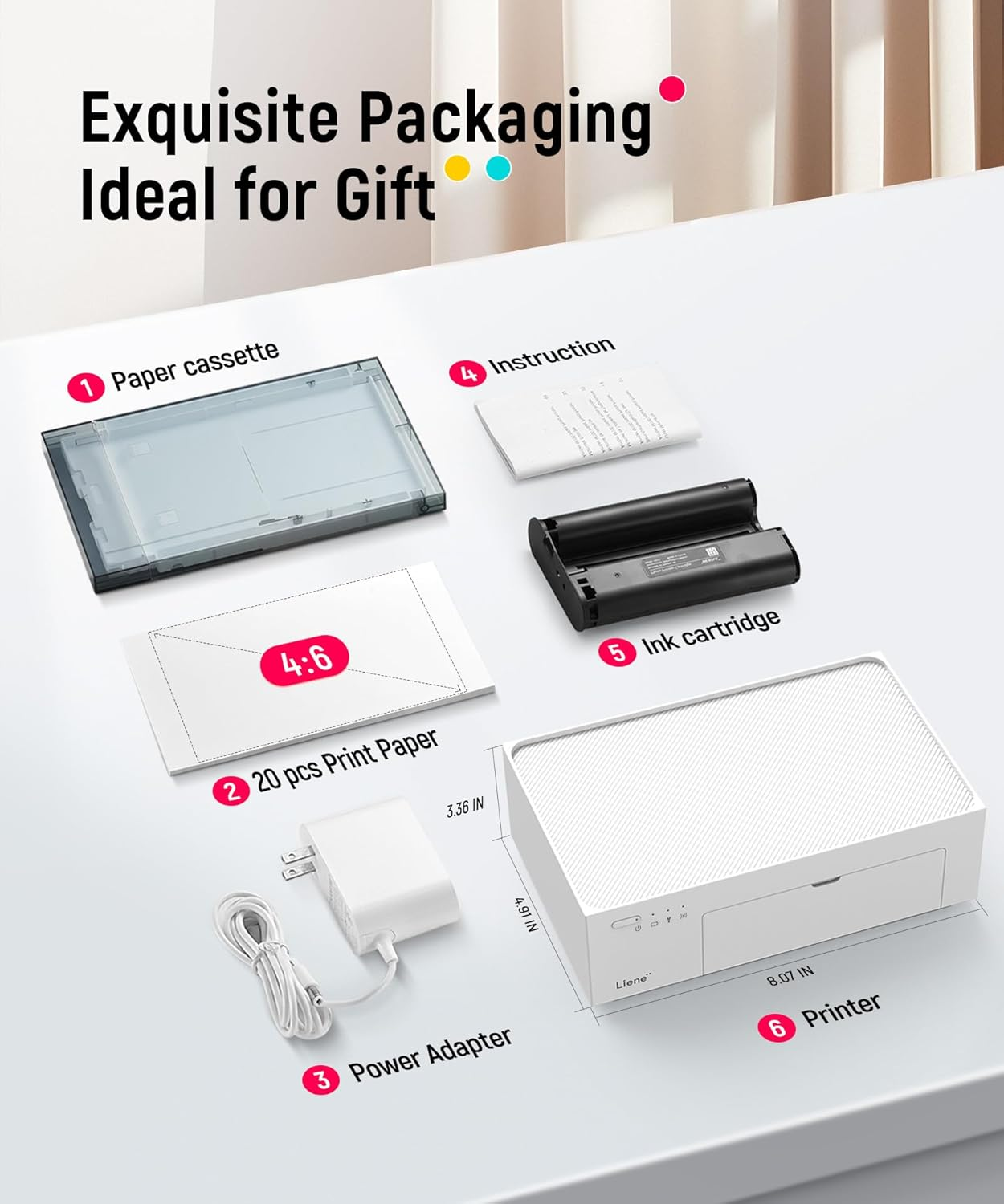 Een printer en accessoires zoals papiercassette, papier, voedingsadapter en inktcartridge.