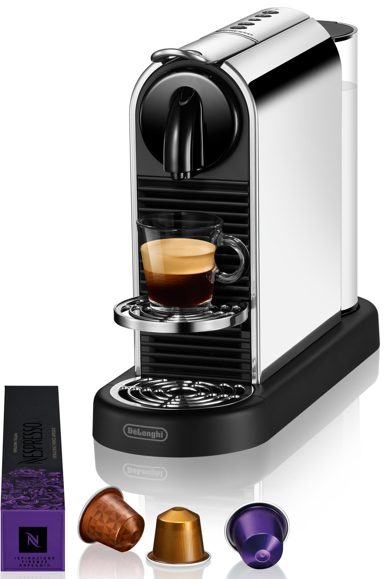 Una macchina da caffè Nespresso con espresso e capsule accanto.