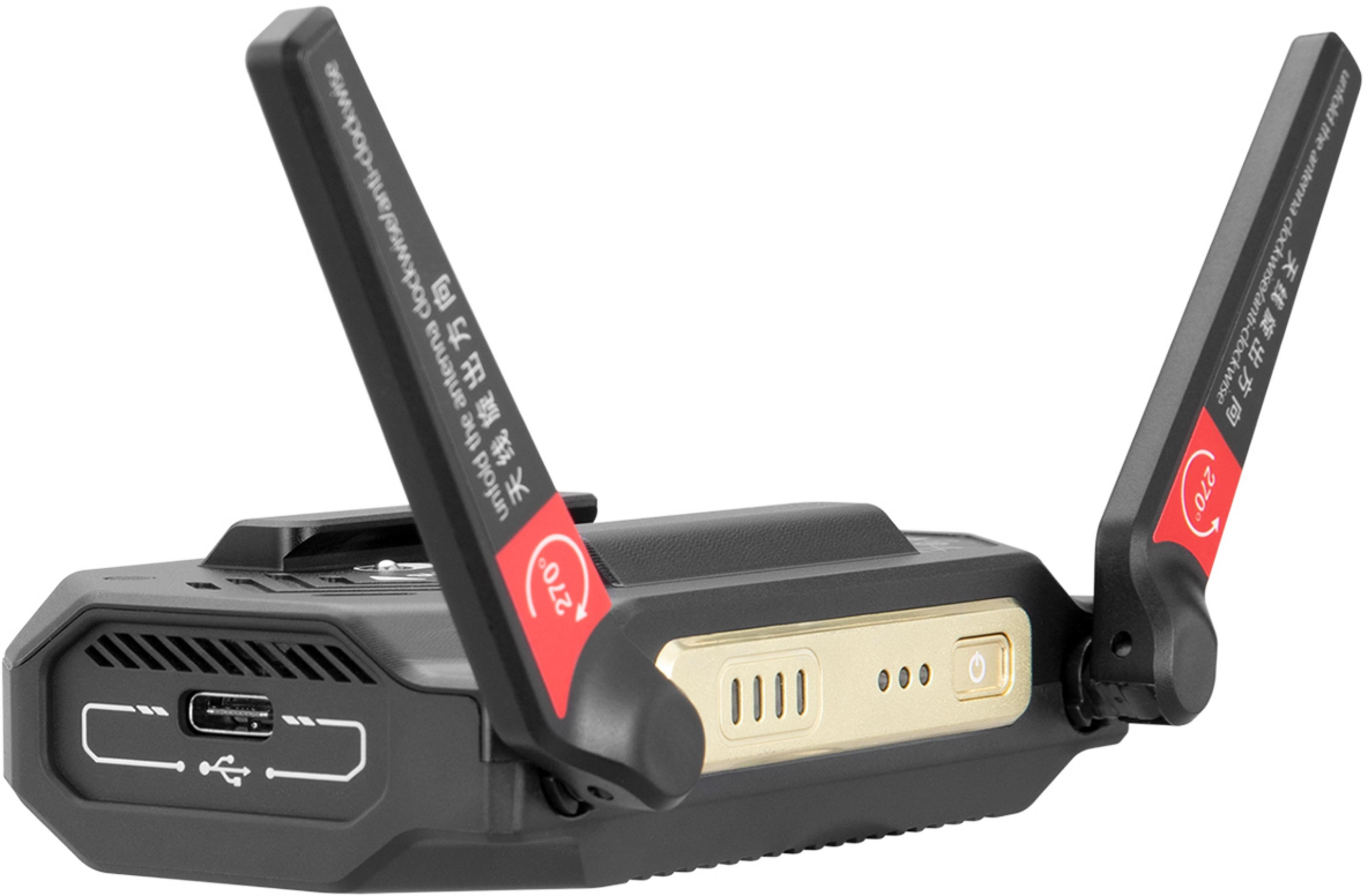 Schwarzes Gerät mit zwei Antennen, USB-Anschluss und goldenen Bedienelementen.