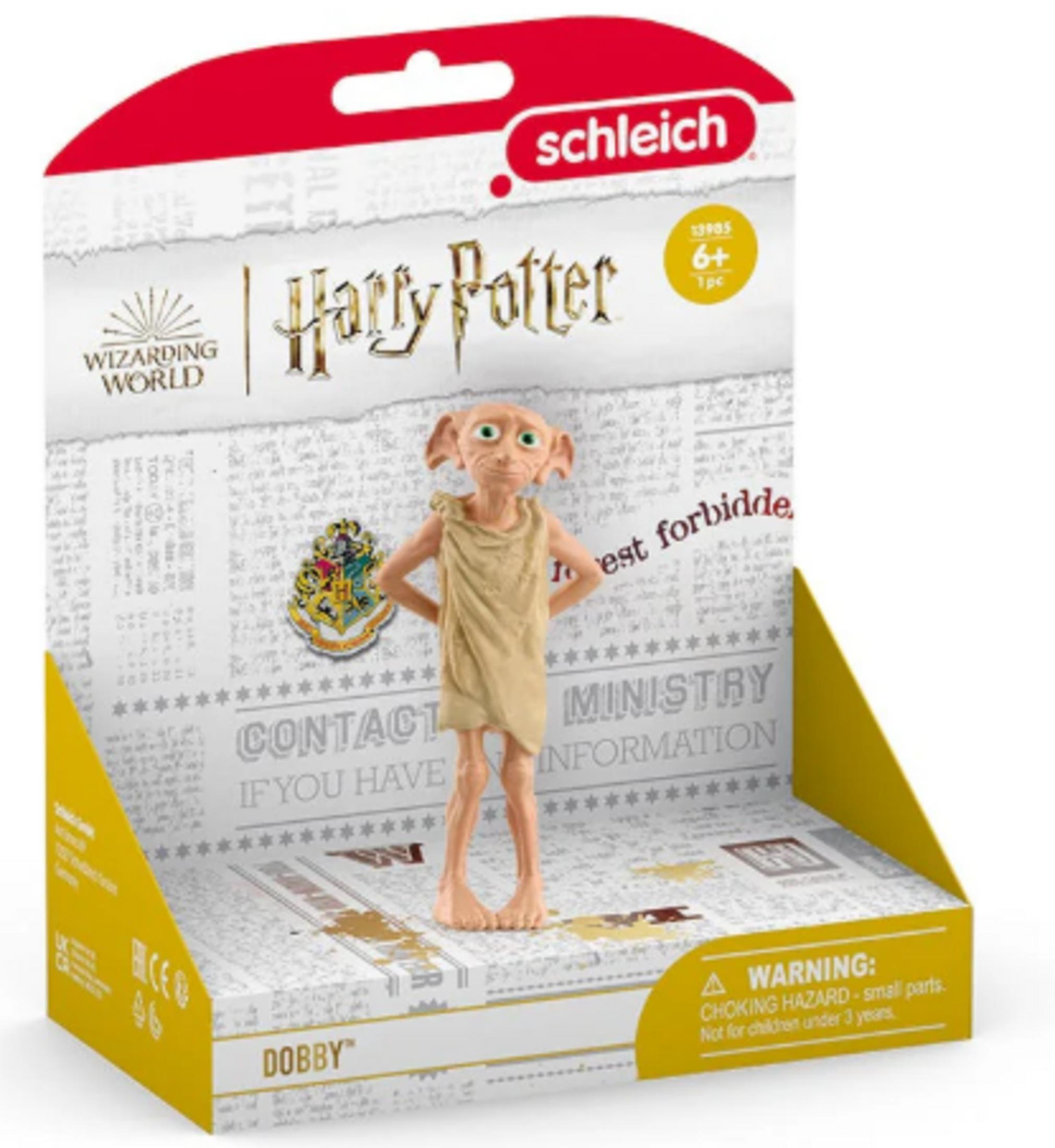 Harry Potter Dobby Spielfigur in Verpackung mit Hogwarts-Wappen und Warnhinweis.