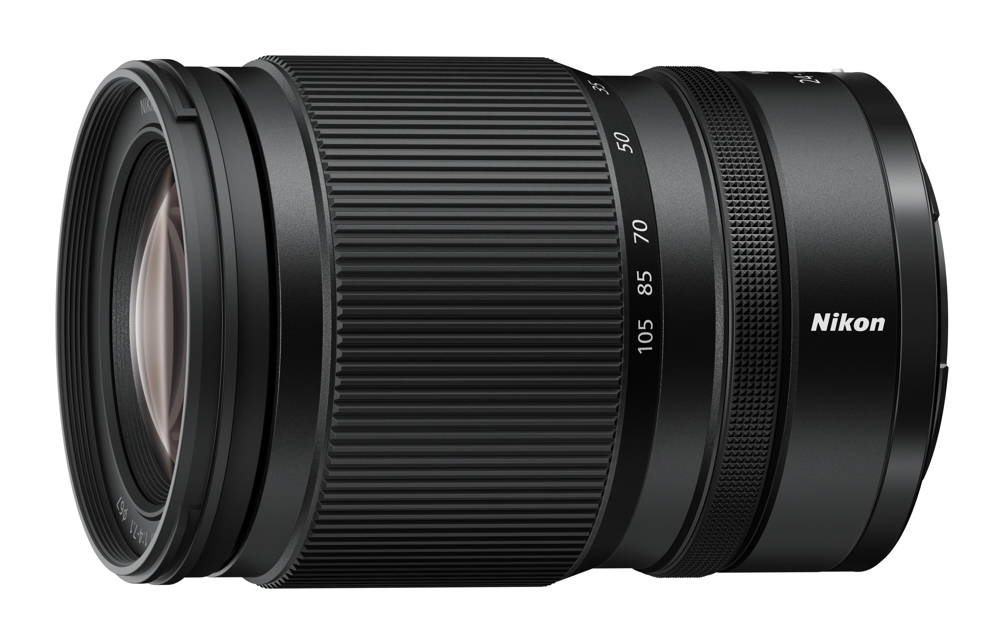 Yakınlaştırma halkası ve odak ölçeği olan siyah Nikon lens, beyaz arka plan.