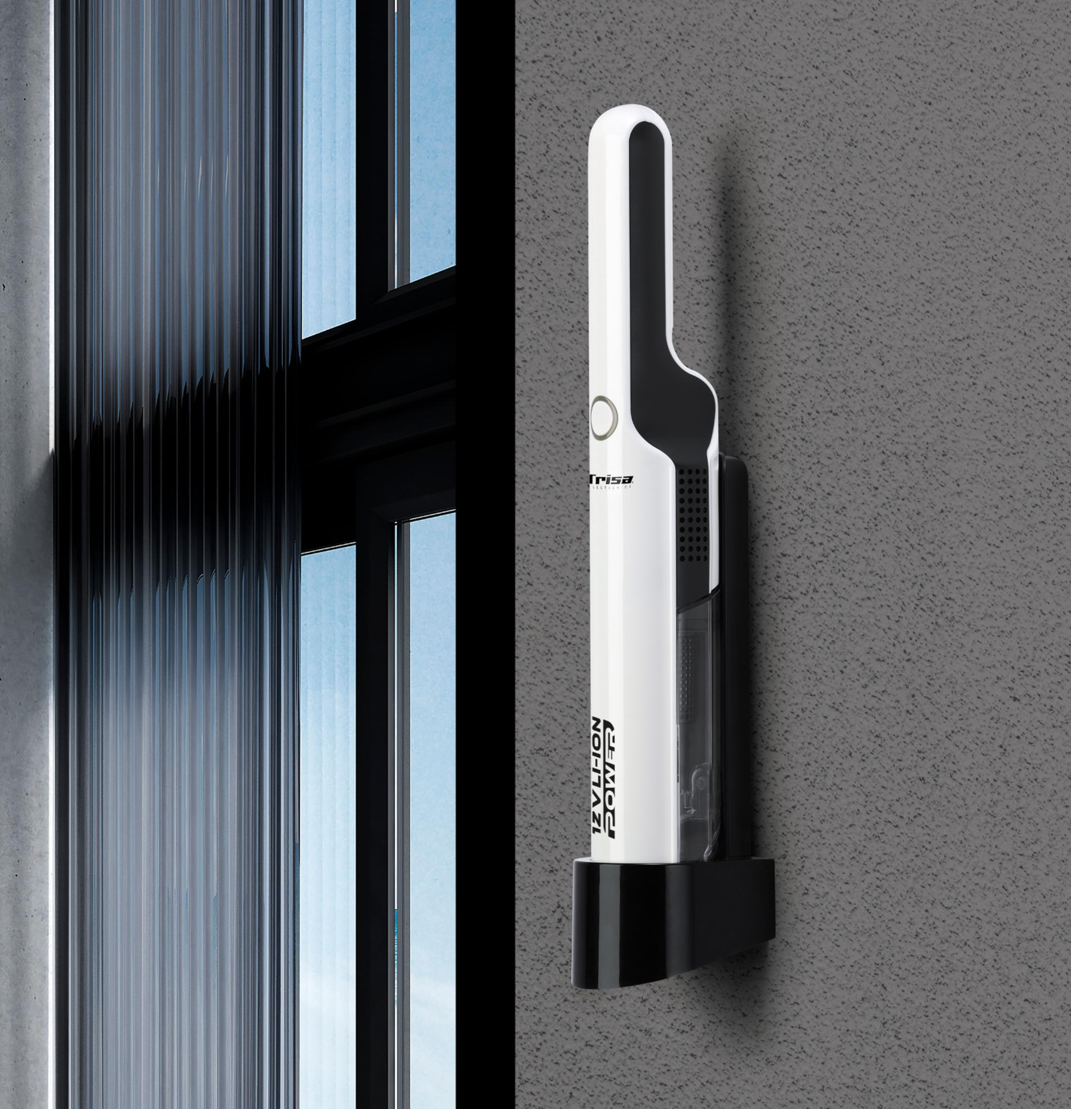 Un aspirapolvere portatile bianco con accenti neri è montato su un muro grigio.