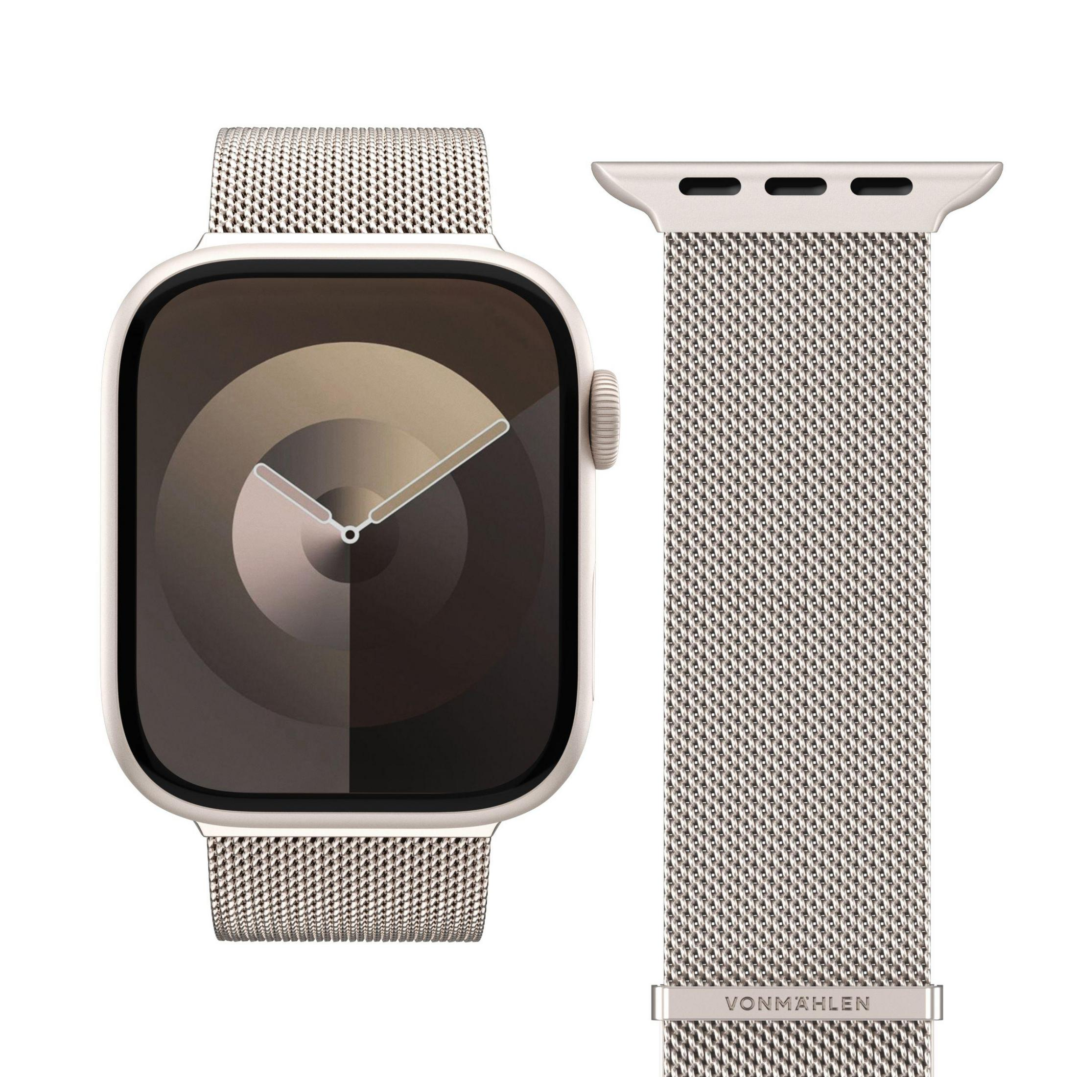Une montre connectée argentée avec un bracelet milanais et un bracelet séparé.