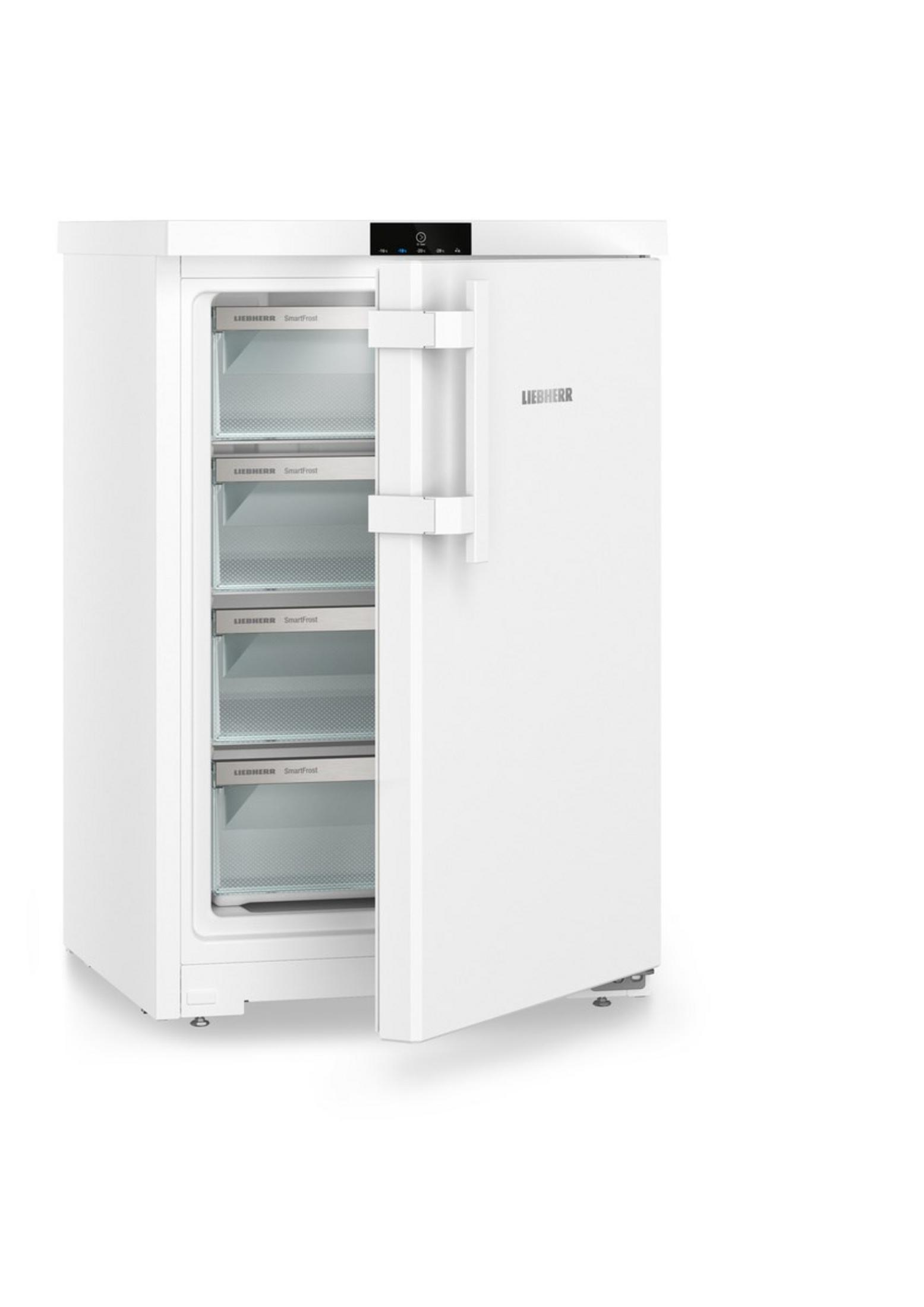 Un congélateur blanc Liebherr, porte ouverte, quatre tiroirs visibles.