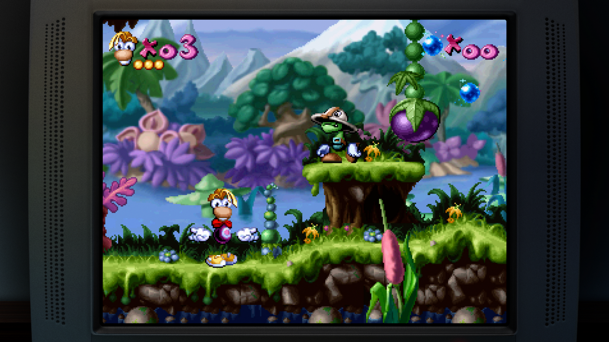 Rayman gioca in un mondo 2D colorato con colline verdi, piante viola e uno stagno.