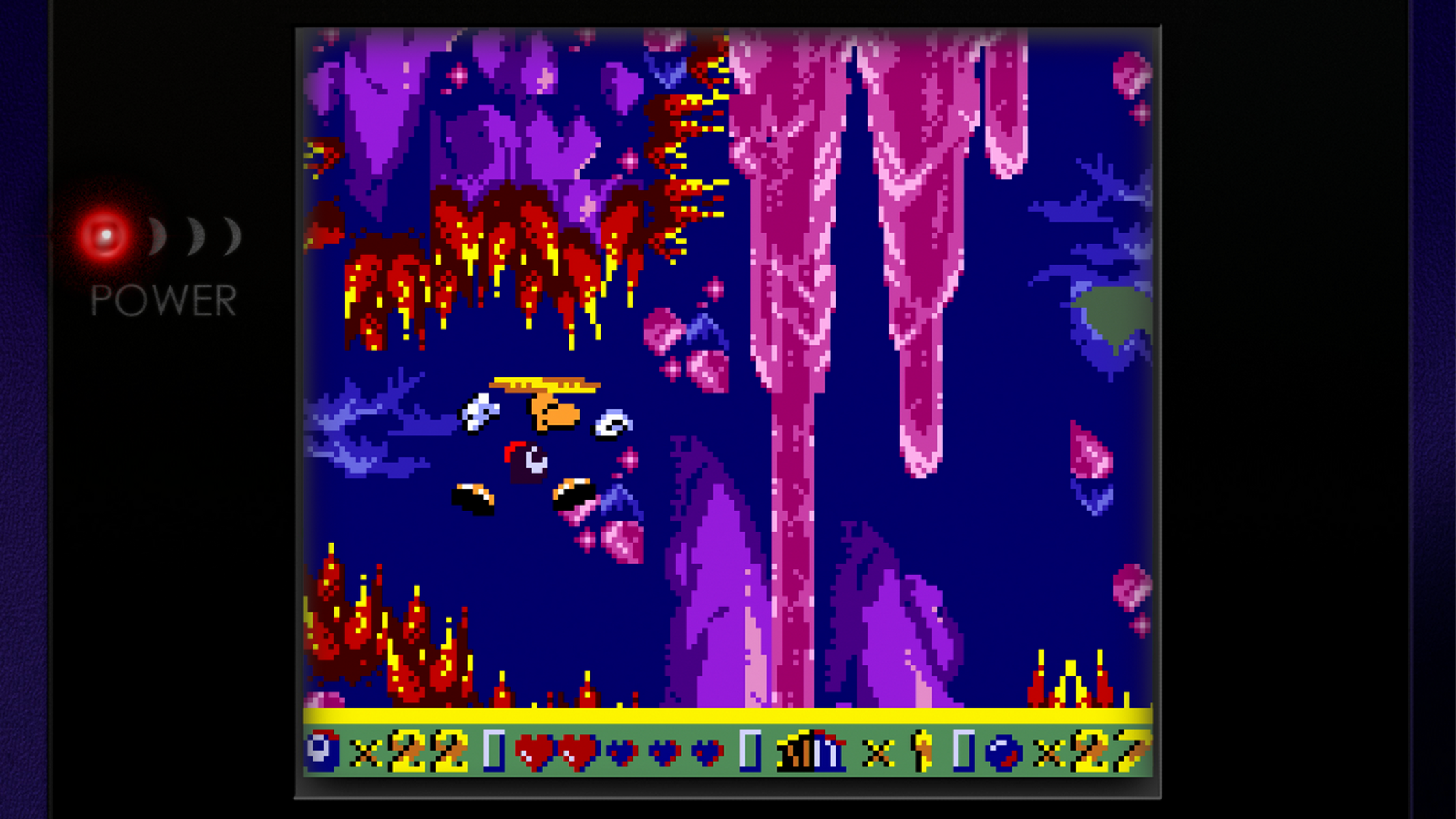 Videogioco in pixel art con creature viola e rosse in una grotta oscura.