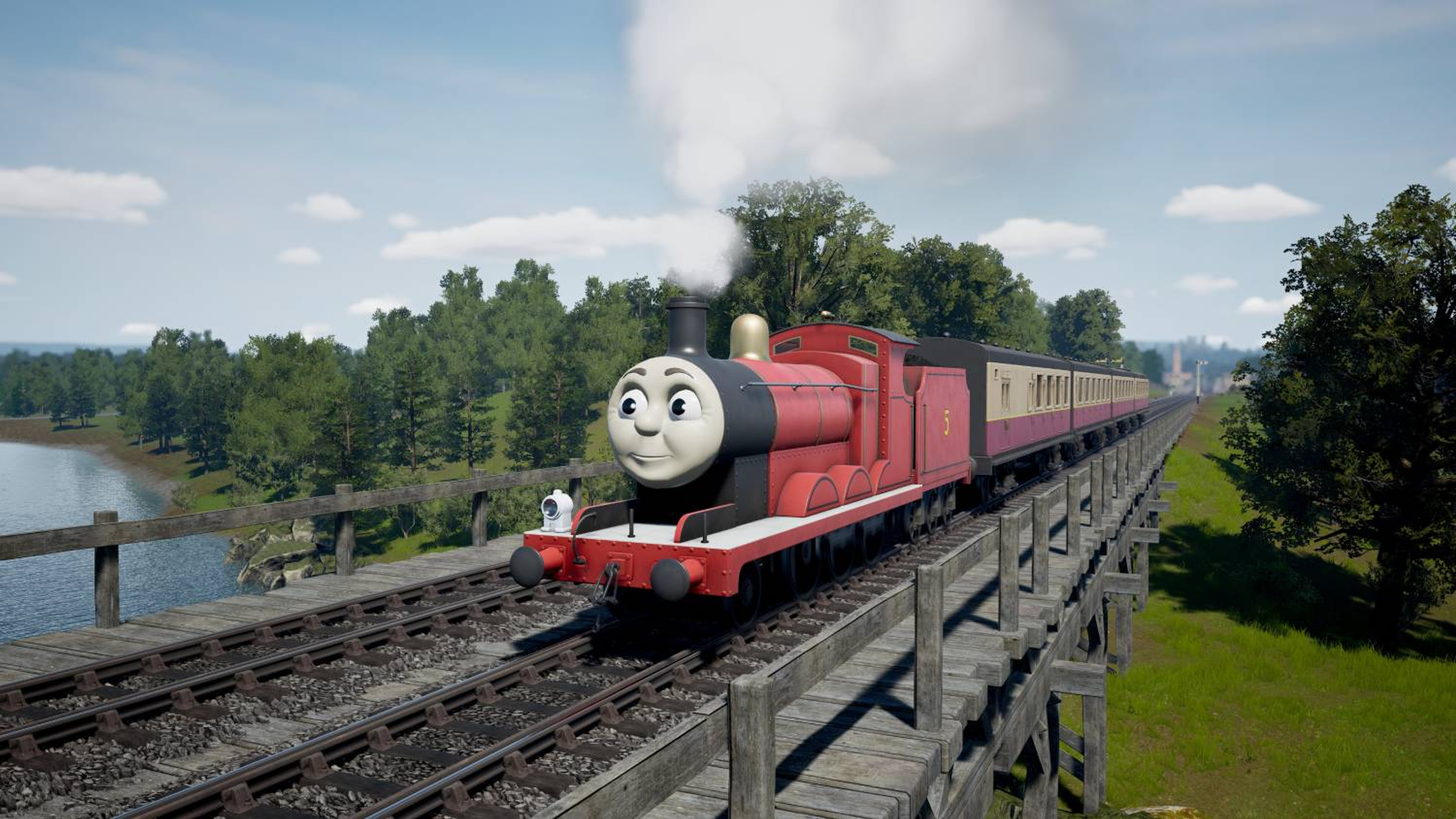 James, la locomotiva a vapore rossa, viaggia su un ponte di legno sopra un fiume, circondato da alberi.