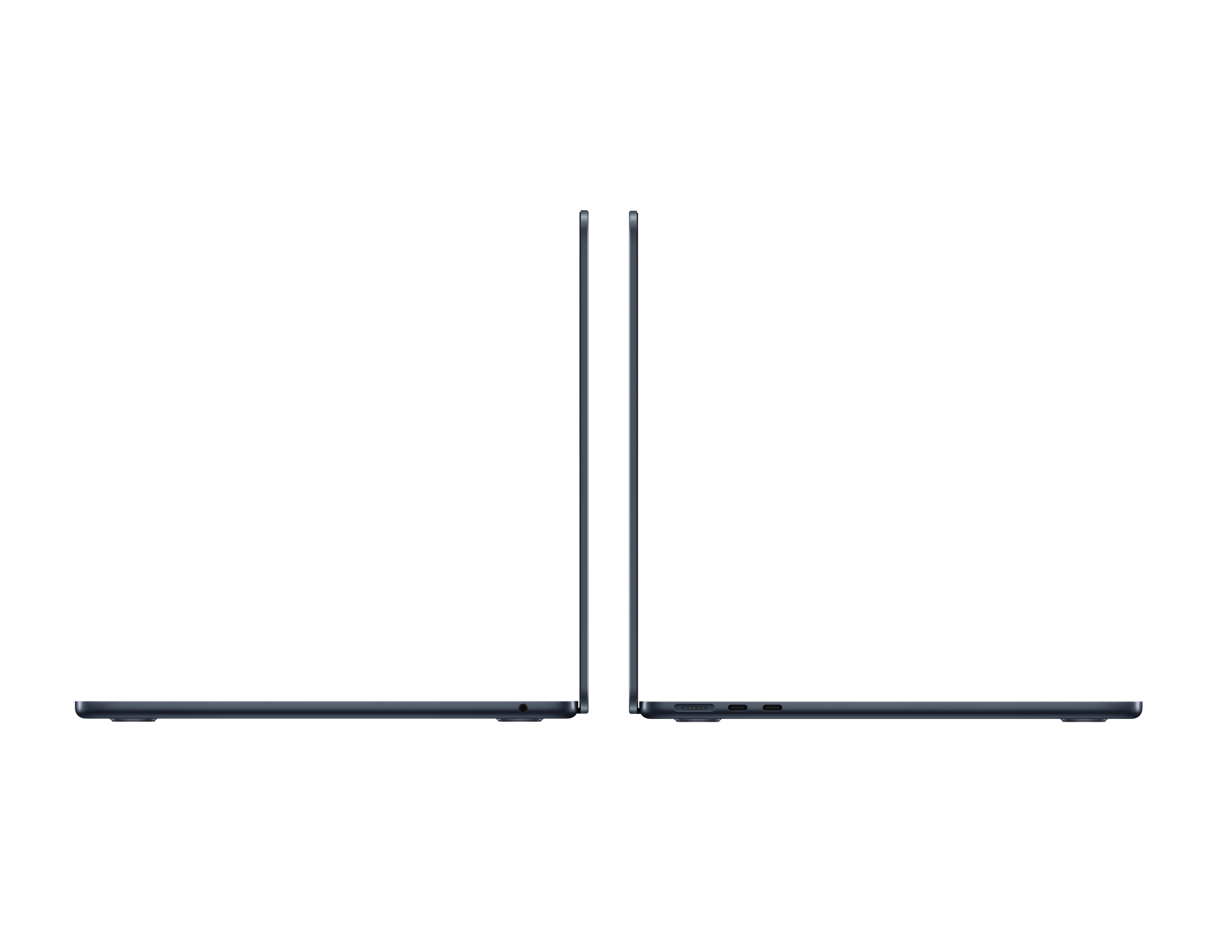 Dos portátiles oscuros uno al lado del otro, mostrados de lado. Uno tiene un conector de auriculares.