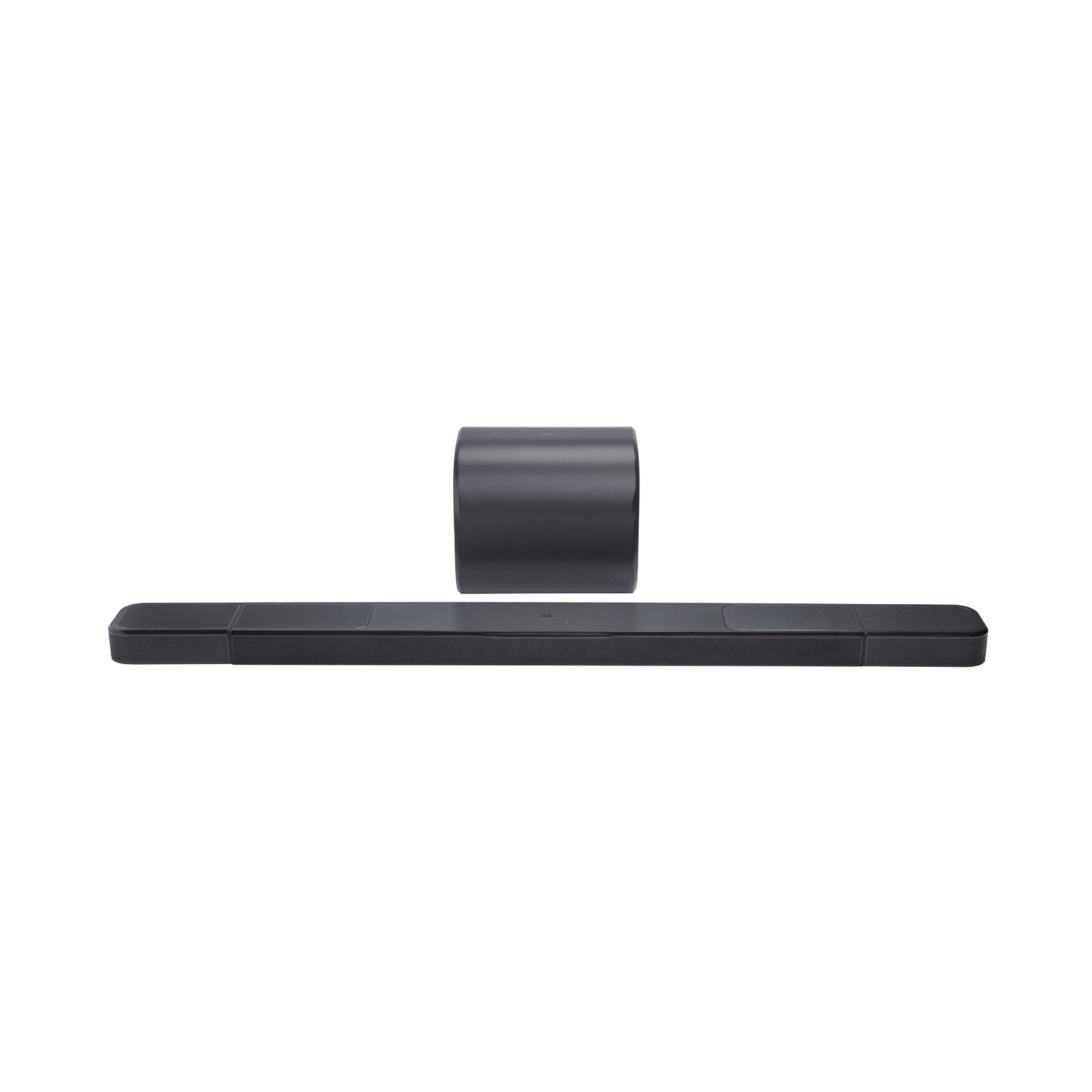 Barra de sonido negra con subwoofer sobre fondo blanco.