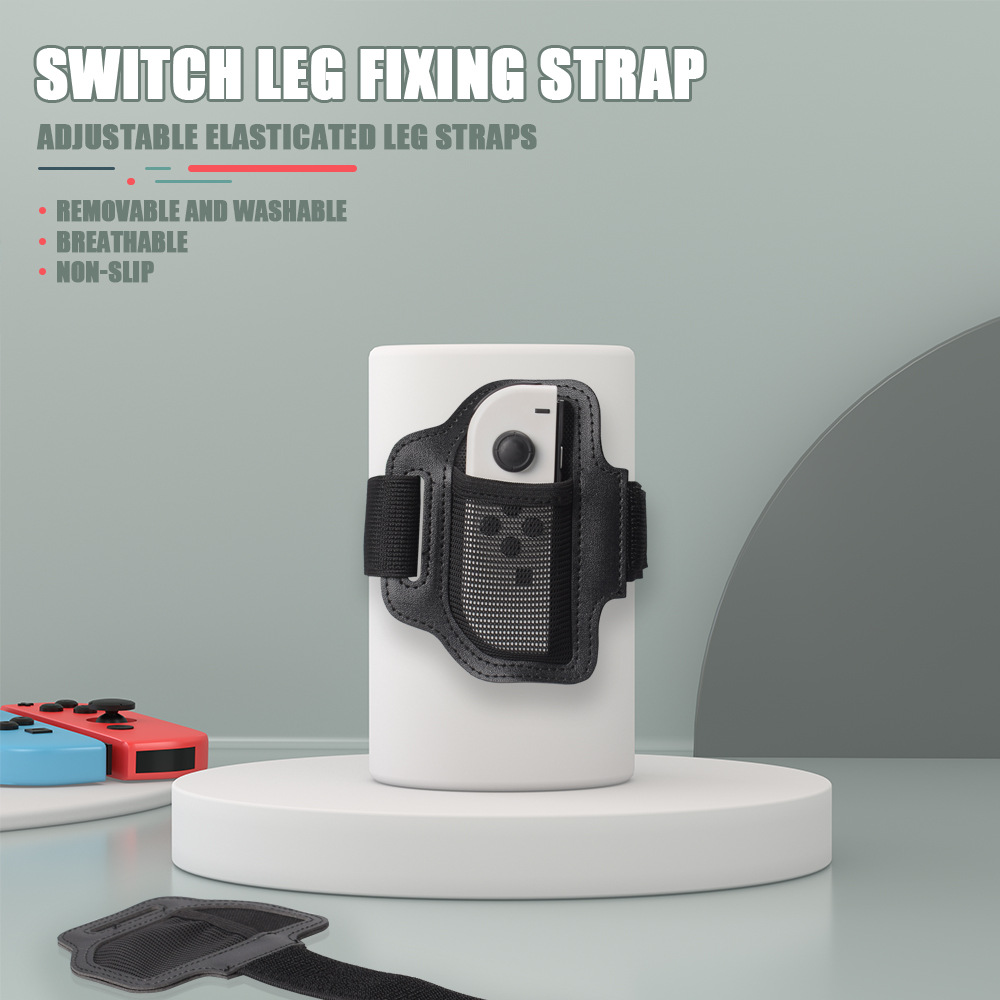 Switch-Beinriemen hält einen weißen Controller. Zwei bunte Controller sind in der Nähe.