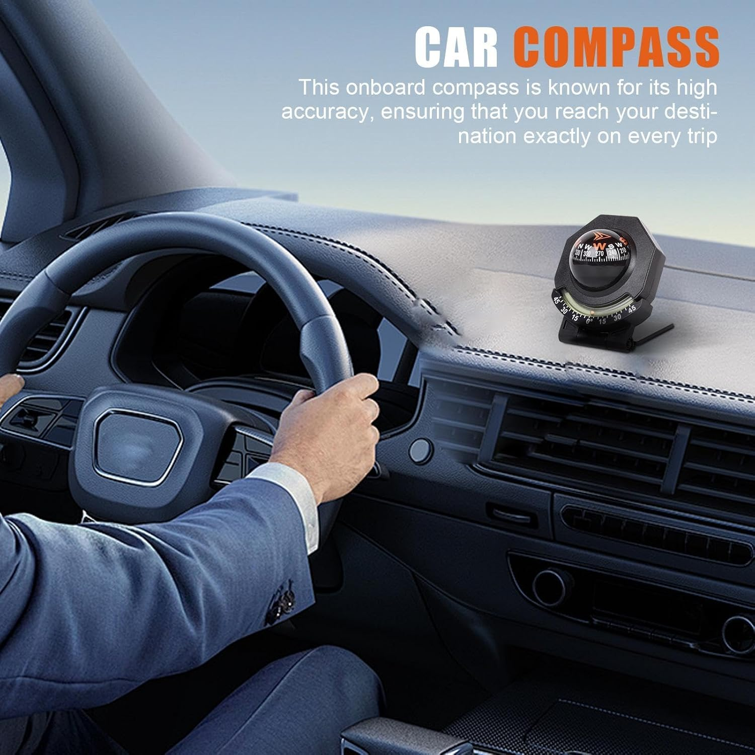 Autodashbord mit Kompass und Fahrerhand am Lenkrad.