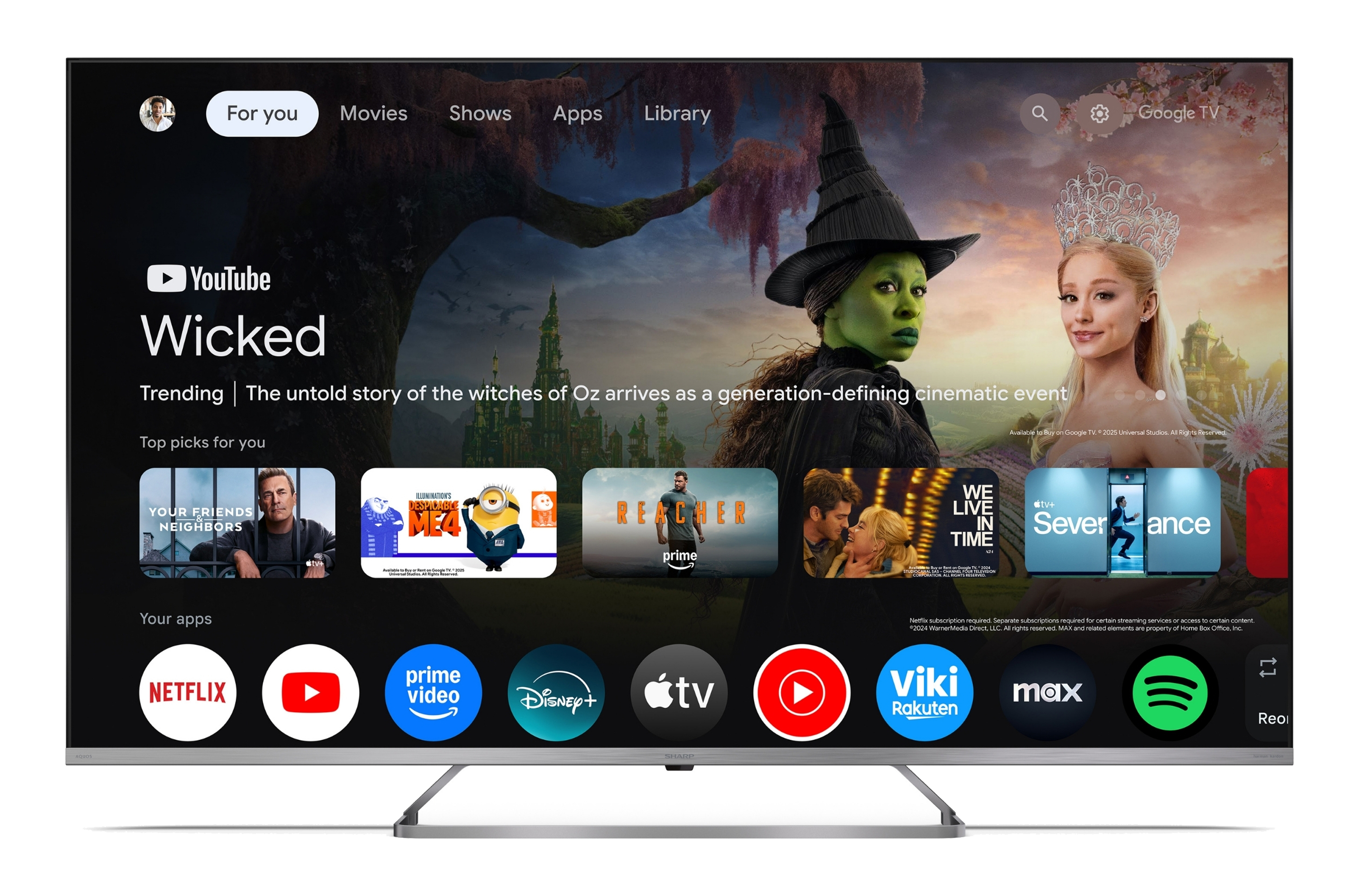 Der Bildschirm zeigt eine Google TV-Oberfläche mit dem Film 'Wicked' im Fokus.
