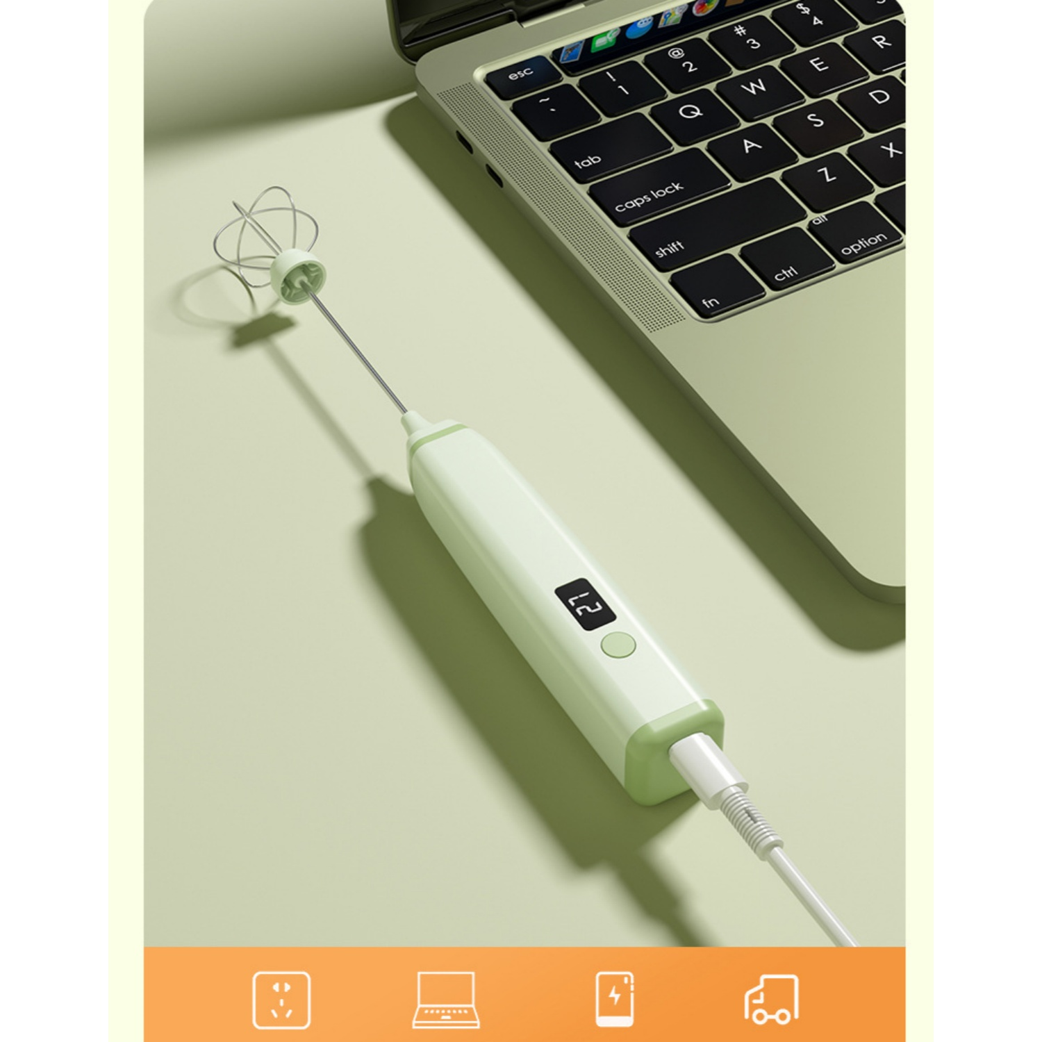 Ein hellgrüner elektrischer Schneebesen mit Digitalanzeige ist an einen Laptop angeschlossen.