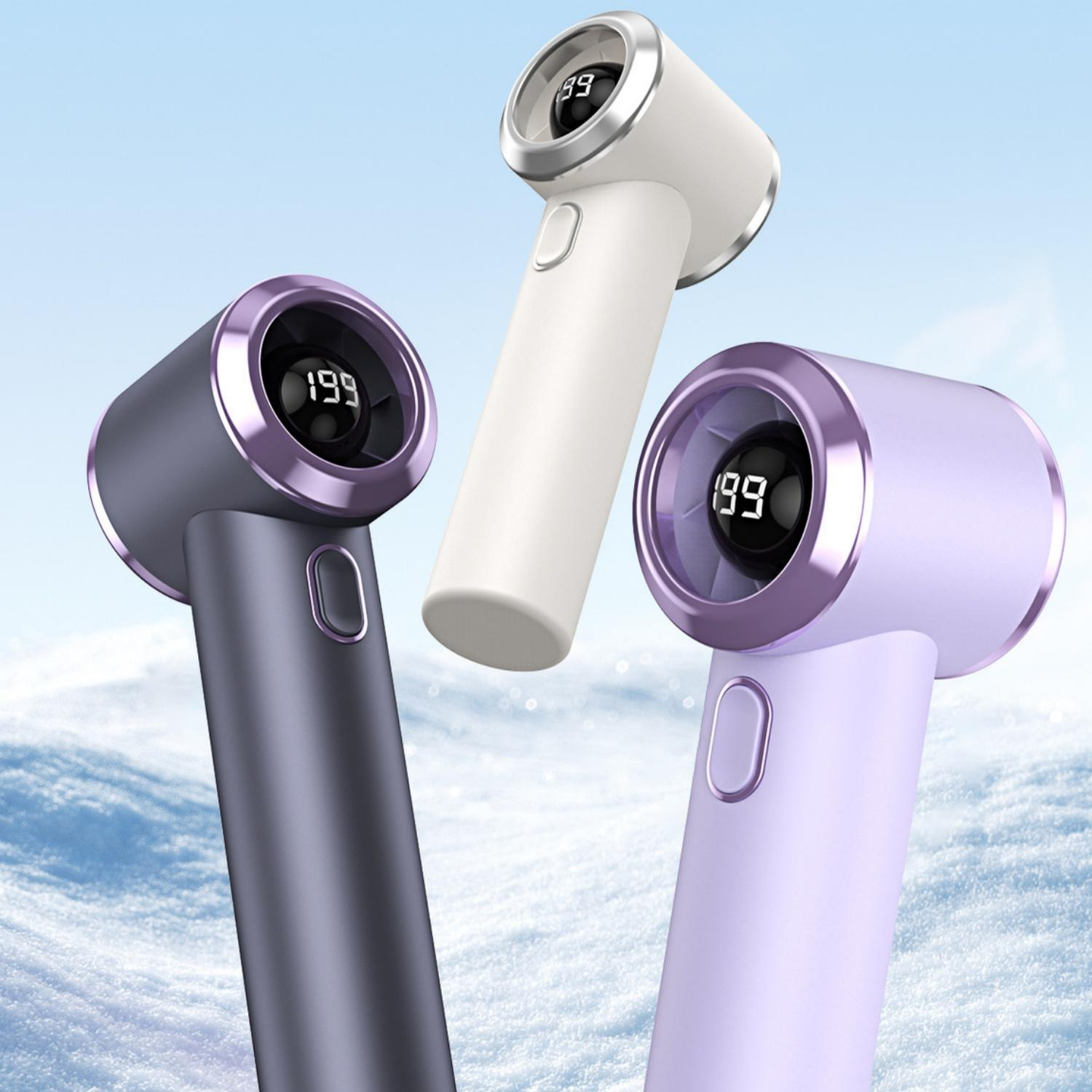 Drei Fusselentferner in Violett, Grau und Weiß mit digitalen Displays auf verschneitem Hintergrund.