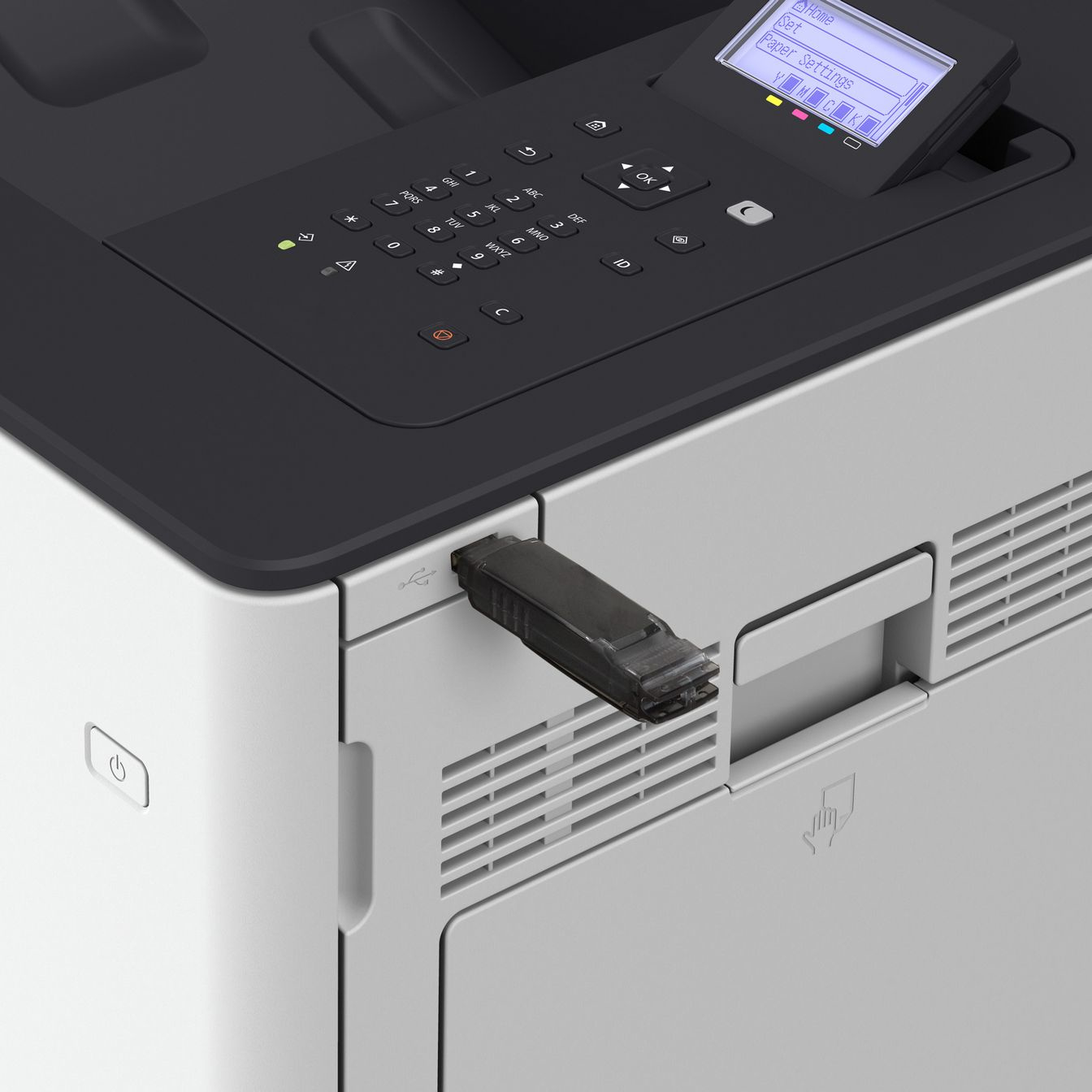 Una memoria USB está conectada a una impresora láser con teclado y pantalla.