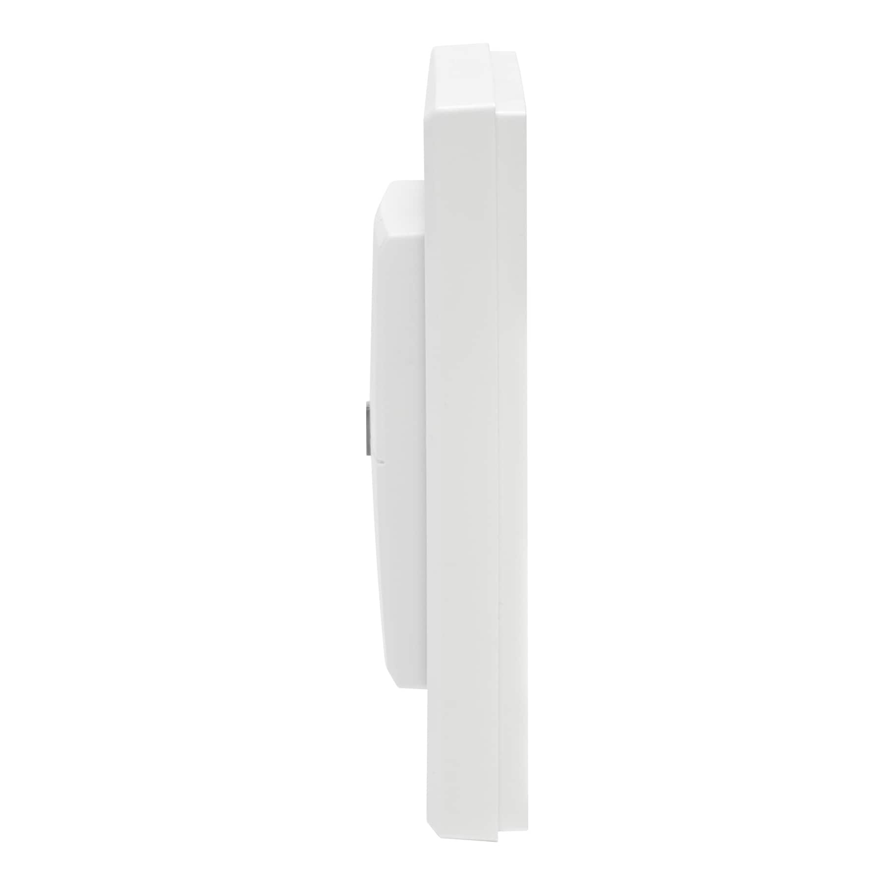 Vue latérale d'un appareil blanc et rectangulaire avec une légère courbe.
