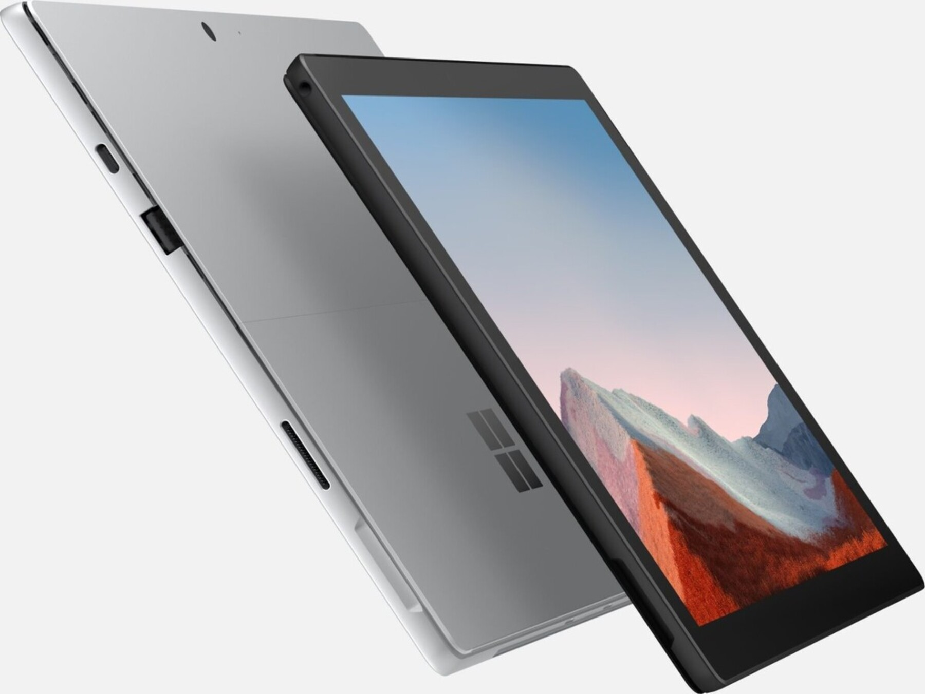 Ein silbernes Tablet mit schwarzem Bildschirm, das einen Berg zeigt.