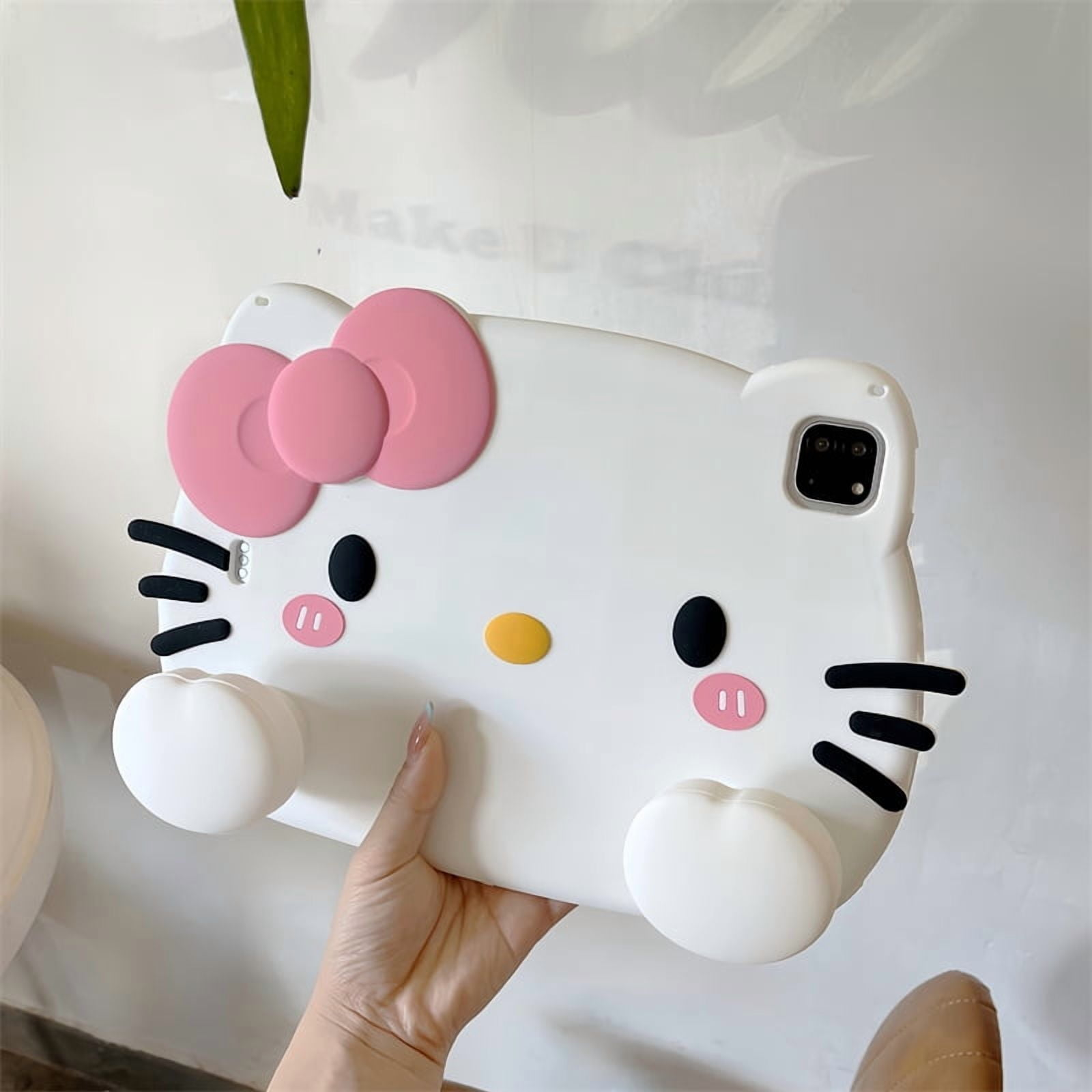 Eine weiße Hello Kitty Hülle mit rosa Schleife und schwarzen Akzenten.