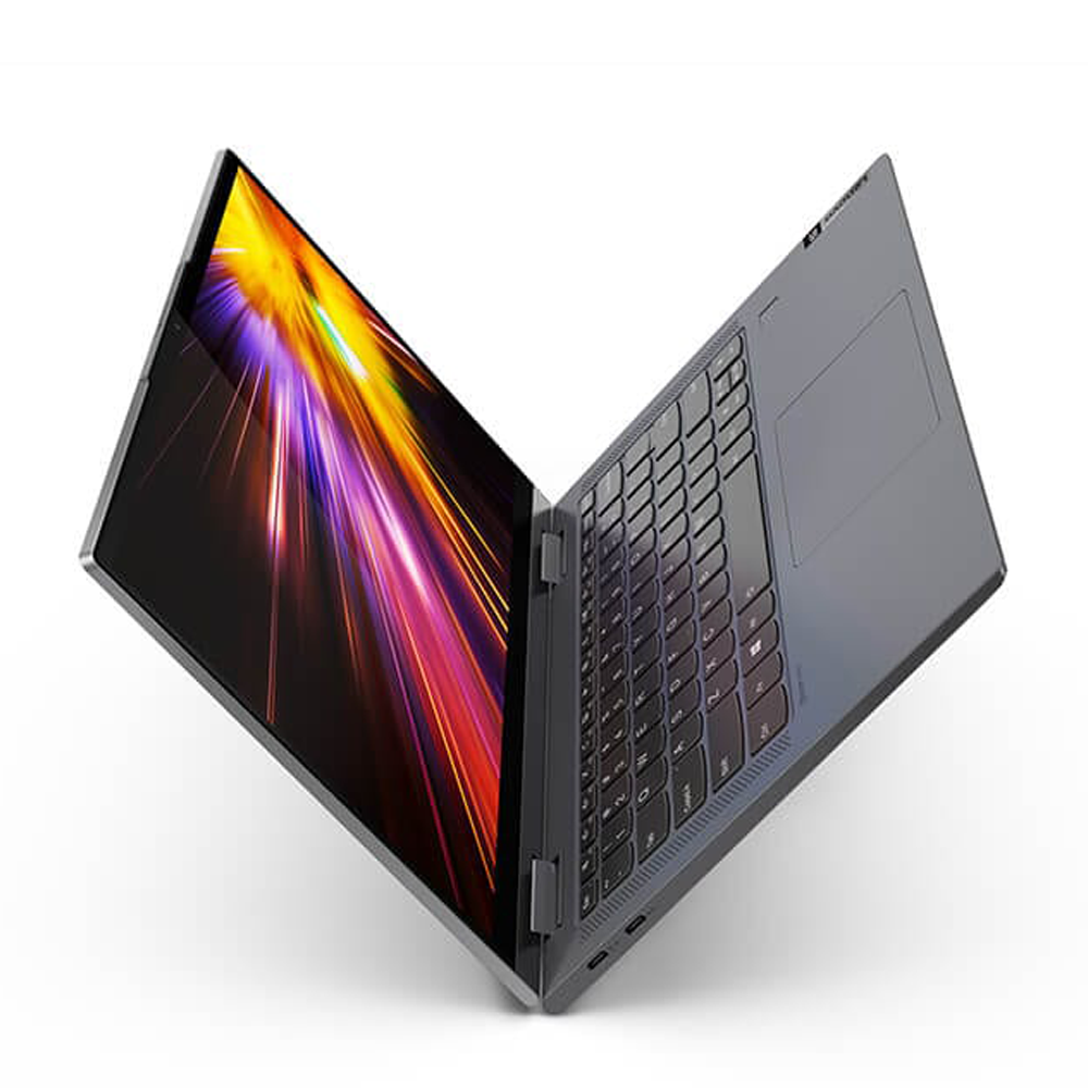 Szary laptop z kolorowym, abstrakcyjnym tłem ekranu, otwarty na białej powierzchni.