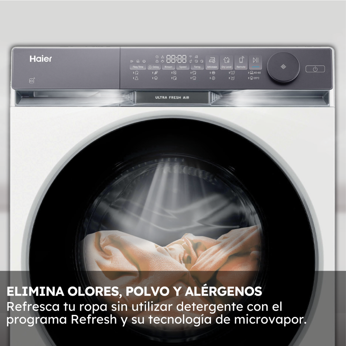 Una lavadora Haier con controles y un tambor con ropa dentro.