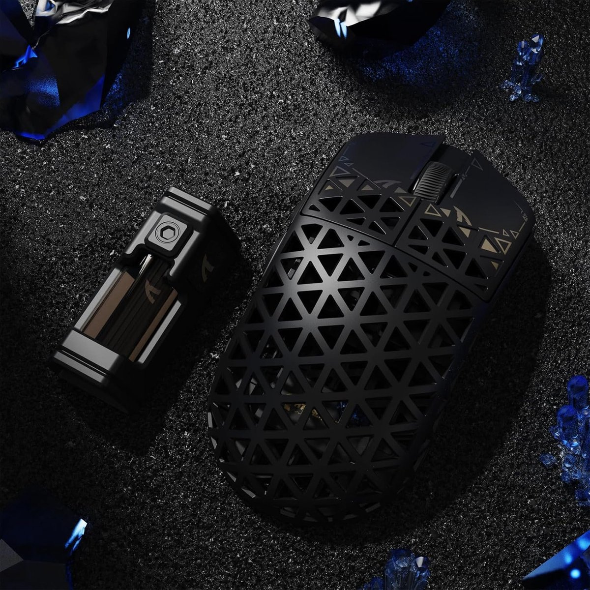 Black gaming mouse and a rectangular device on a black surface.