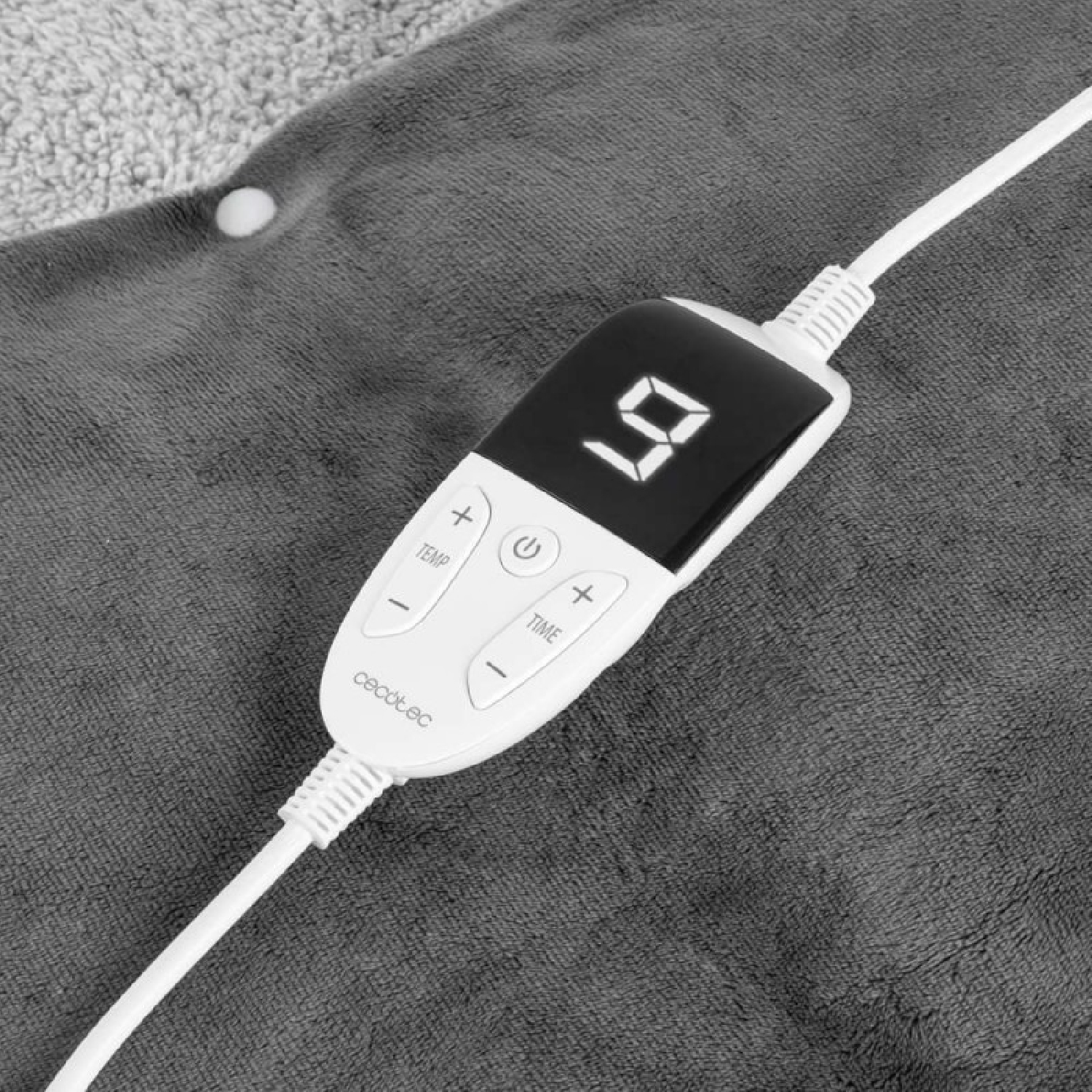 Un controlador de manta eléctrica gris con pantalla digital '9' y botones.