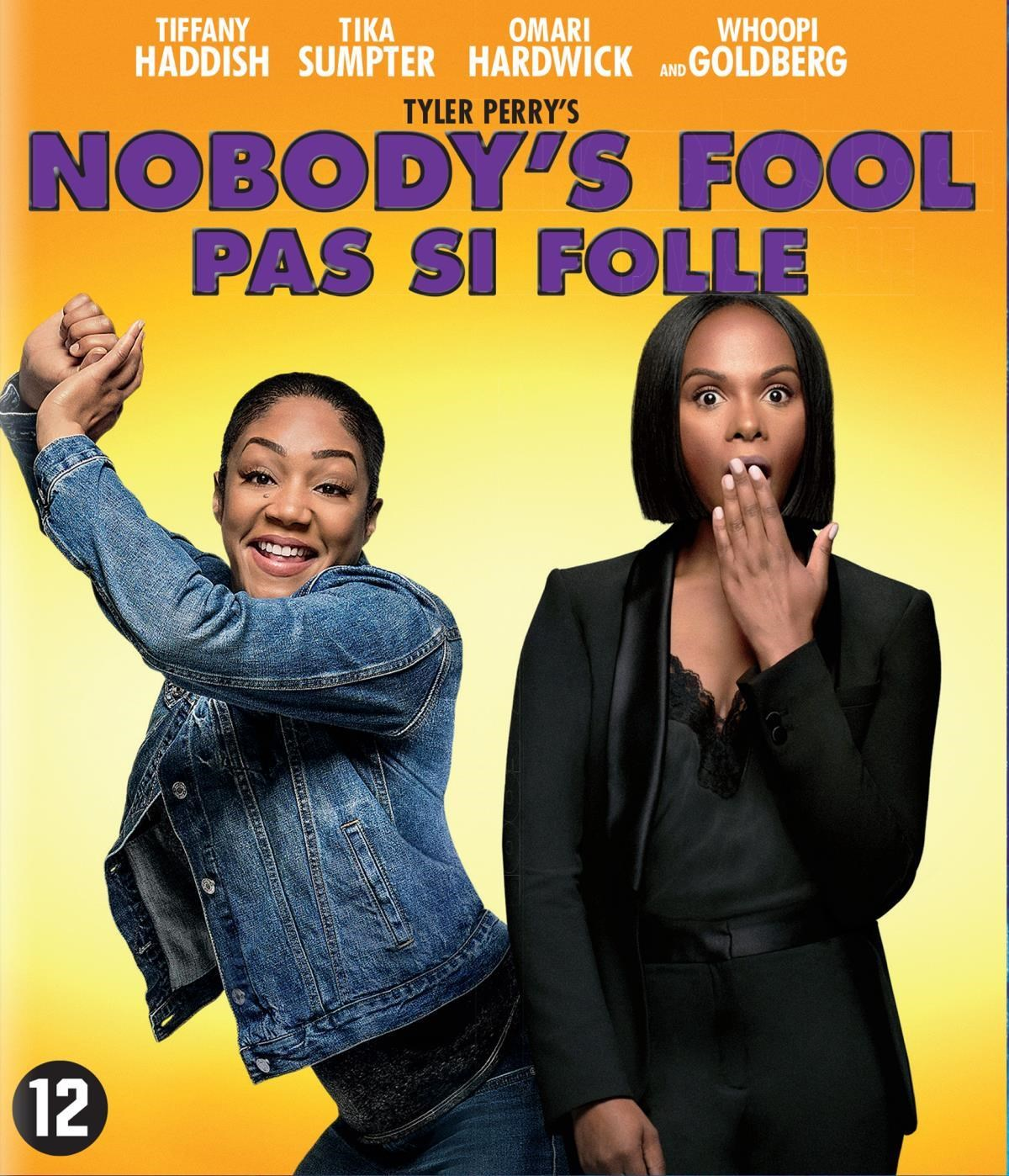 Deux femmes sur affiche de film: Tiffany Haddish en veste en jean, femme surprise en costume noir.