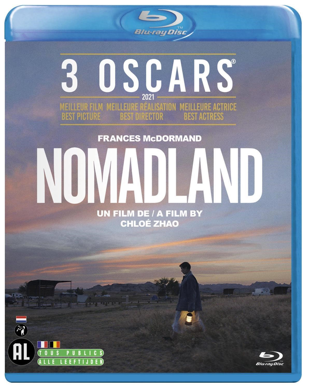 Un homme avec une lanterne traverse un champ au coucher du soleil. Boîtier Blu-ray.