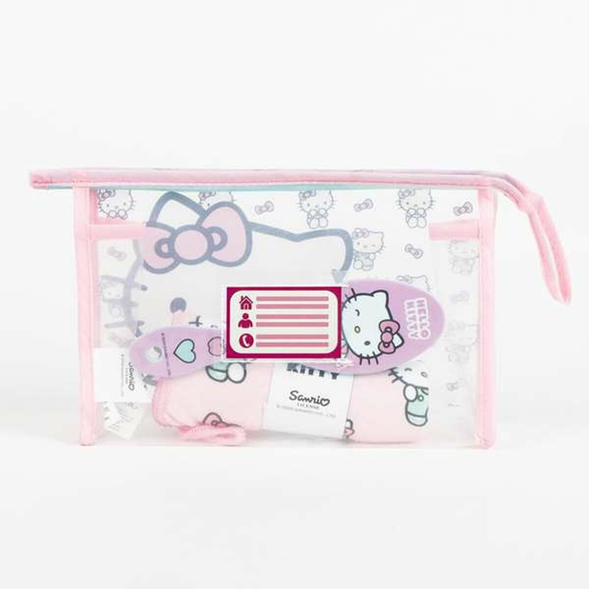 Rosa Kosmetiktasche mit Hello Kitty Motiv, Bürste und anderen Kleinigkeiten.