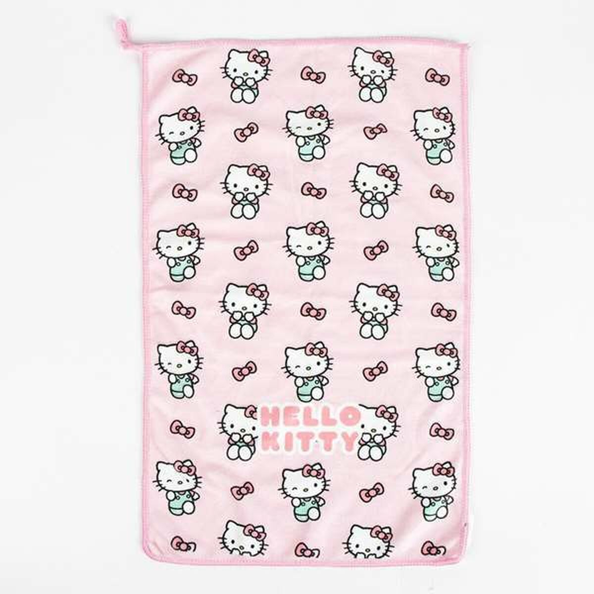 Ein rosa Handtuch mit einem Muster aus Hello Kitty und Schleifen.
