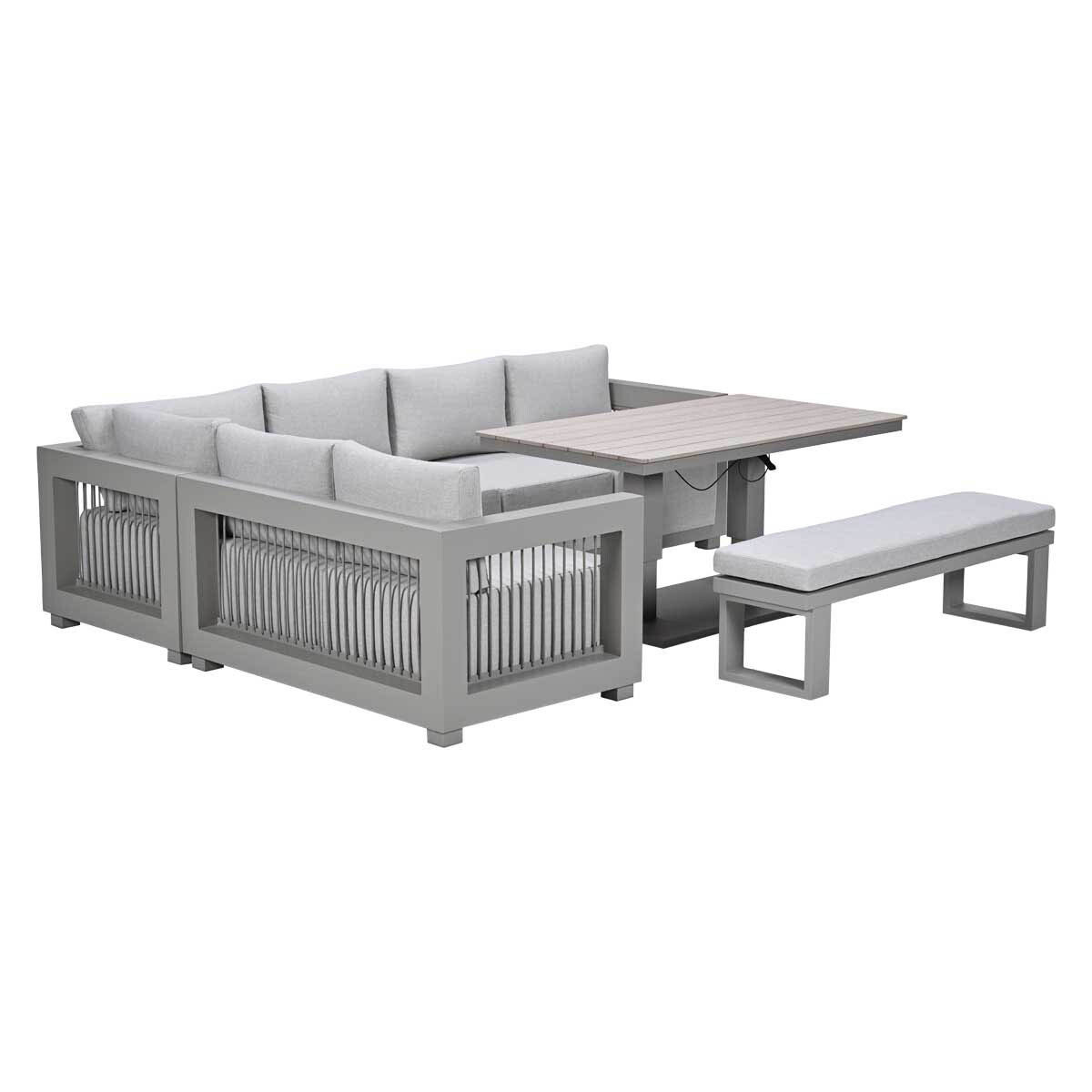 Grijze buitenhoekbank met tafel en bankje.