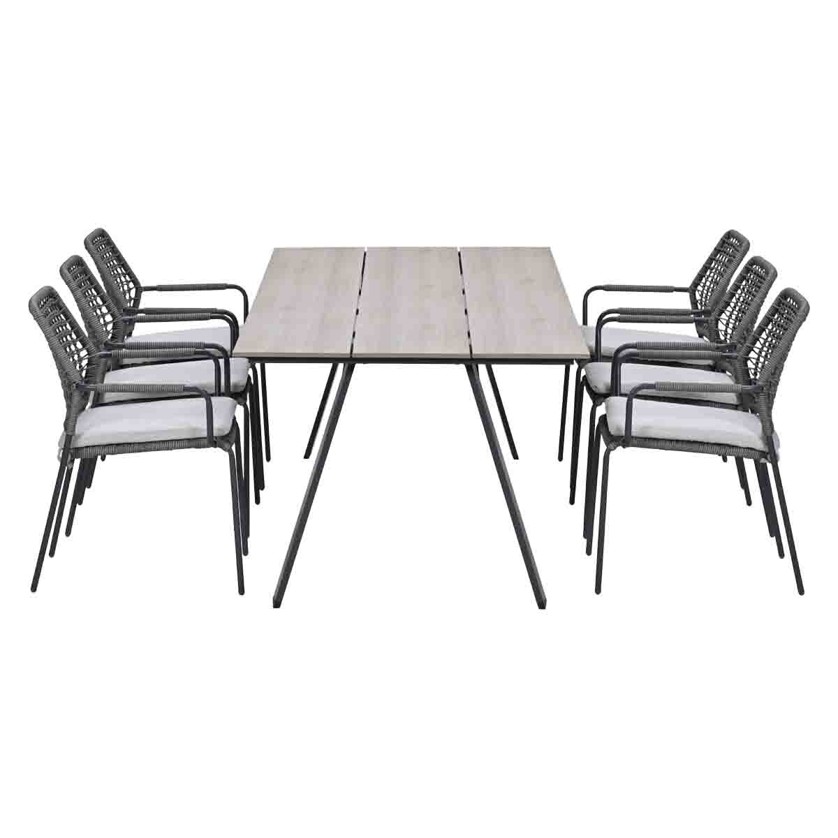 A rectangular table with six grey chairs featuring white cushions.