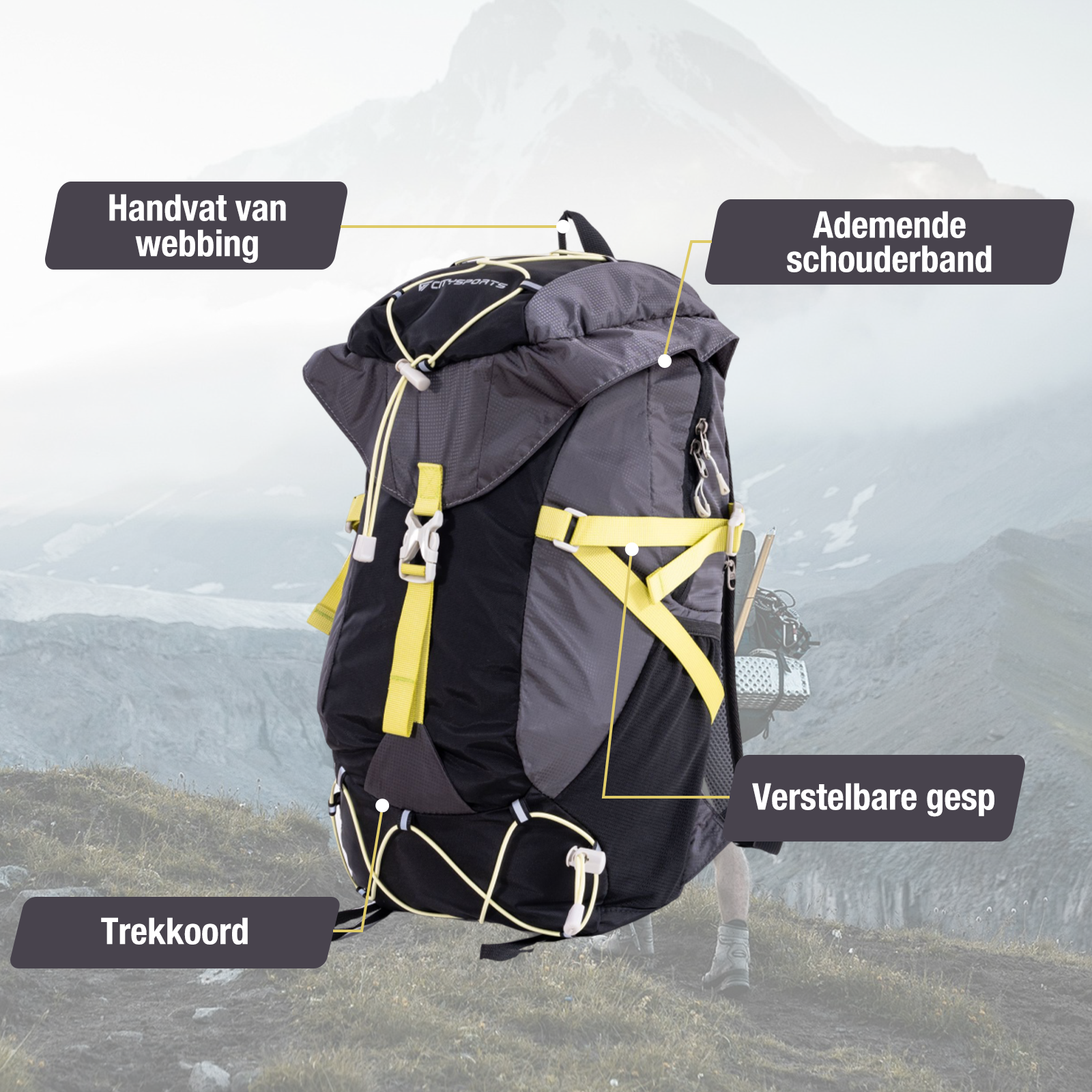 A black backpack with yellow accents stands before a mountain landscape.