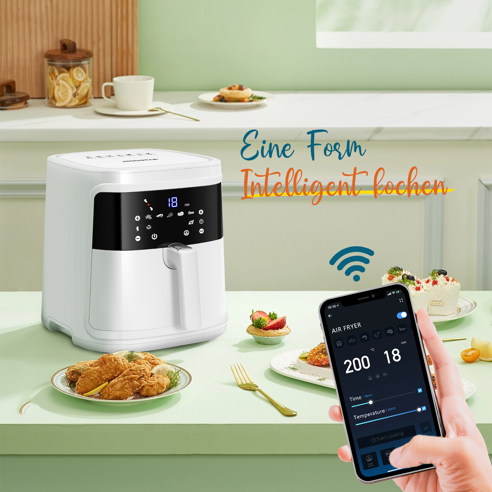 Weiße Heißluftfritteuse mit Kochutensilien und Smartphone-App auf einer Küchentheke.