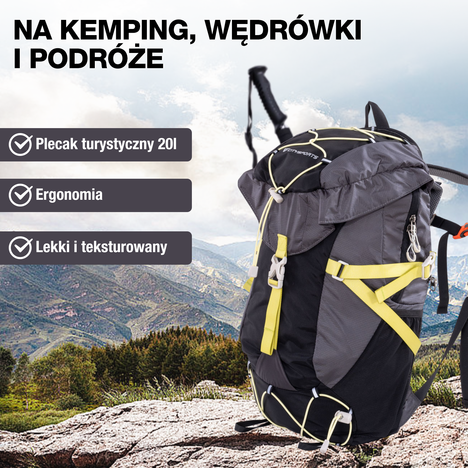 Czarno-szary plecak turystyczny z żółtymi paskami i sznurkami leży na skale, góry w tle.