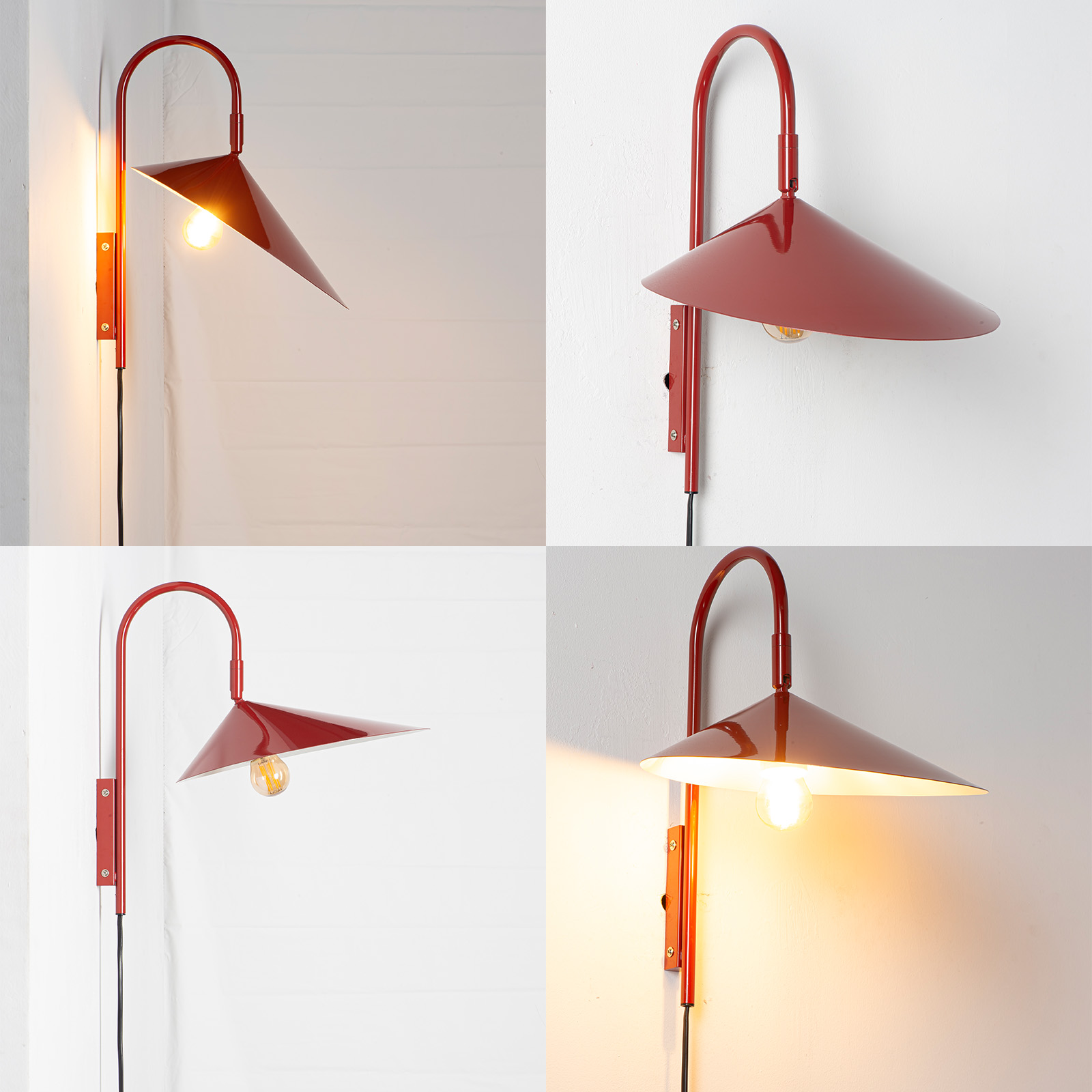 Lámpara de pared roja con brazo curvo y pantalla cónica, bombilla visible.