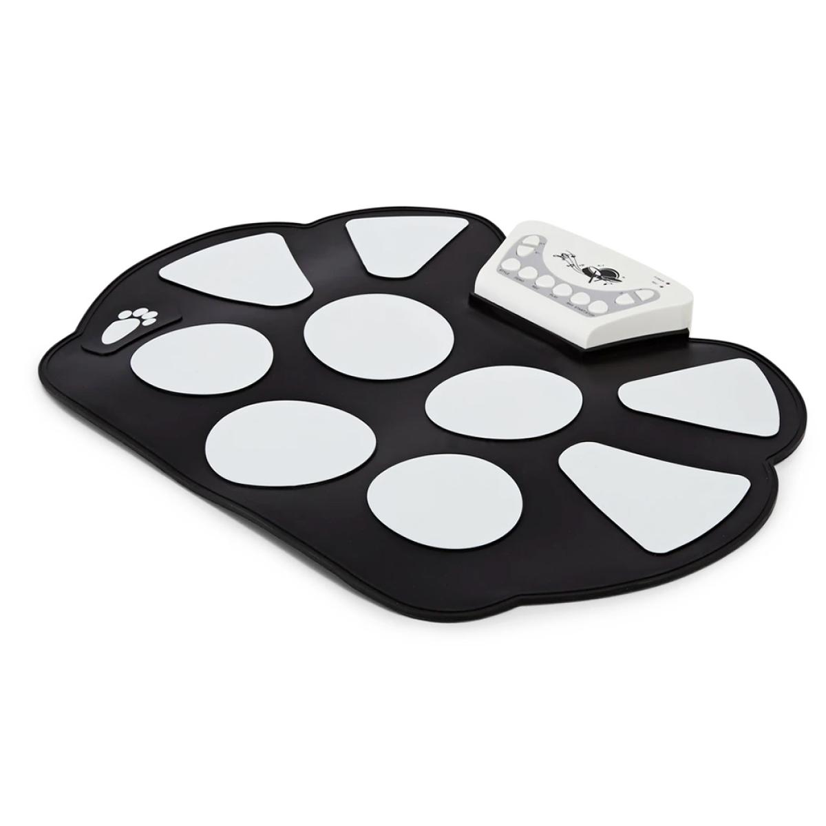 Black paw-shaped drum pad with white drum icons and a control unit.
