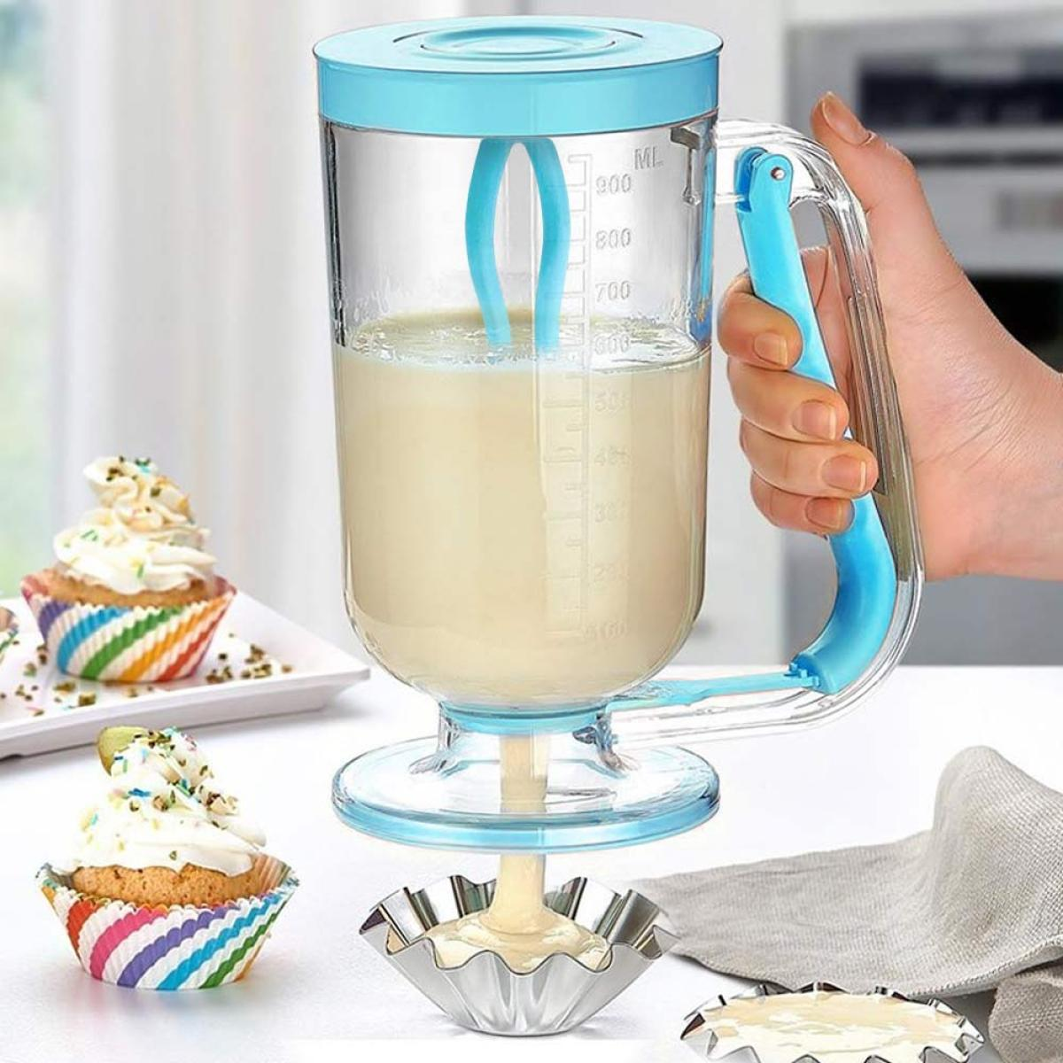 A blue-handled batter dispenser with measurement markings is dispensing batter.