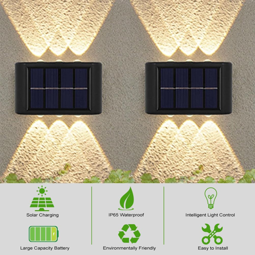 Zwei schwarze Solarwandleuchten beleuchten eine texturierte Wand mit Lichtstrahlen nach oben und unten.