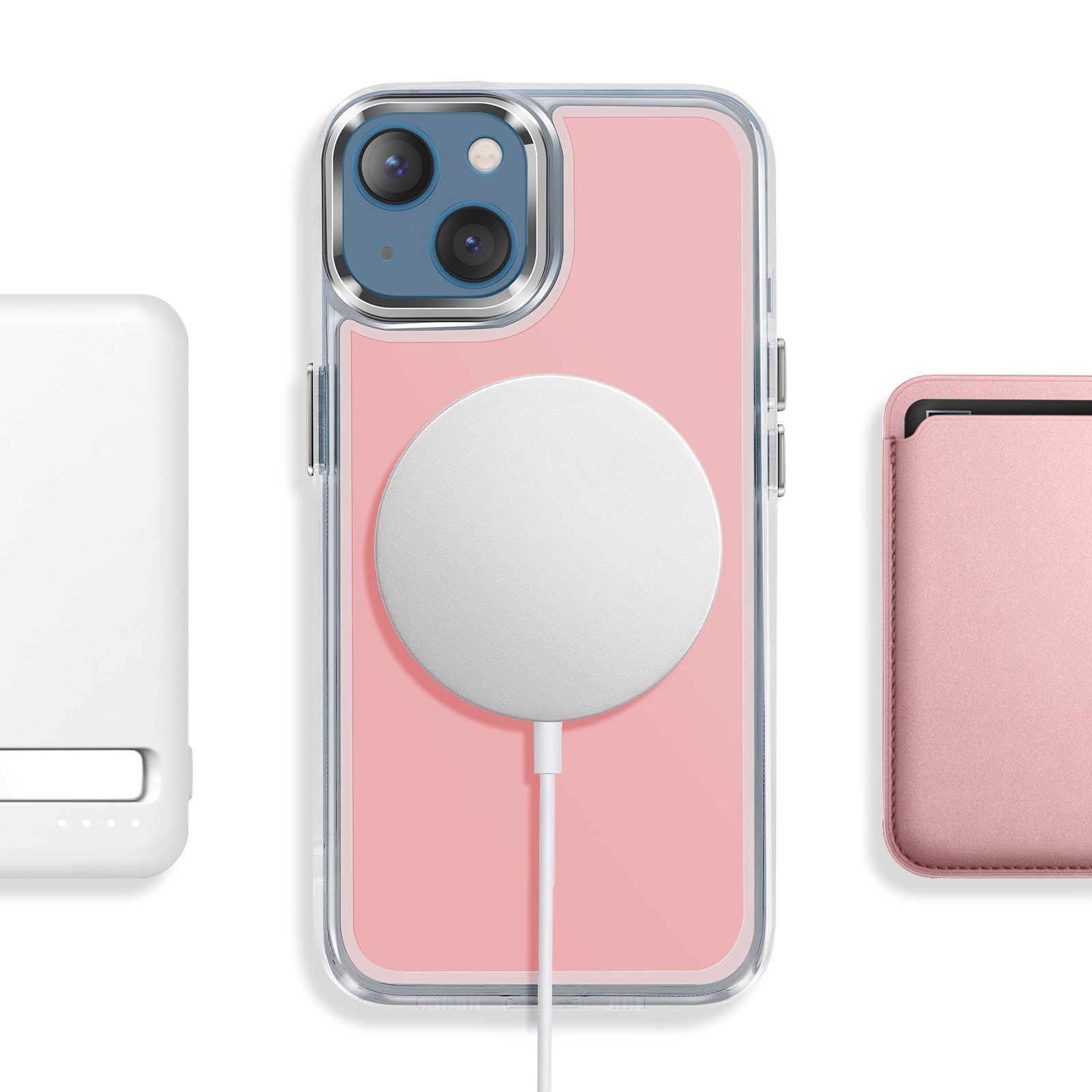 Ein rosa iPhone mit MagSafe-Ladegerät, daneben ein weißes Ladegerät und eine rosa Kartenhülle.