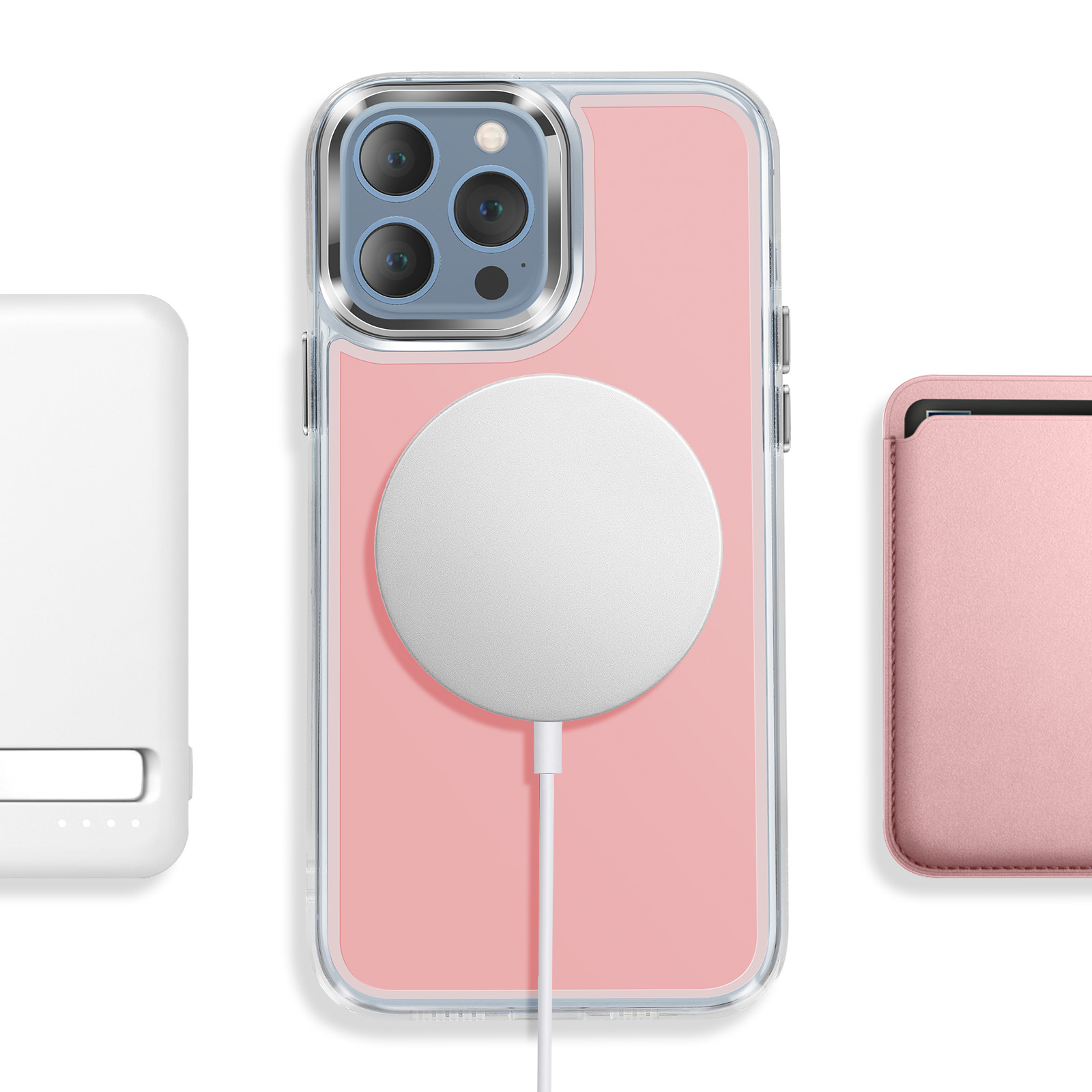 Een roze telefoon in een doorzichtige hoes met MagSafe-oplader, witte powerbank en kaarthouder.