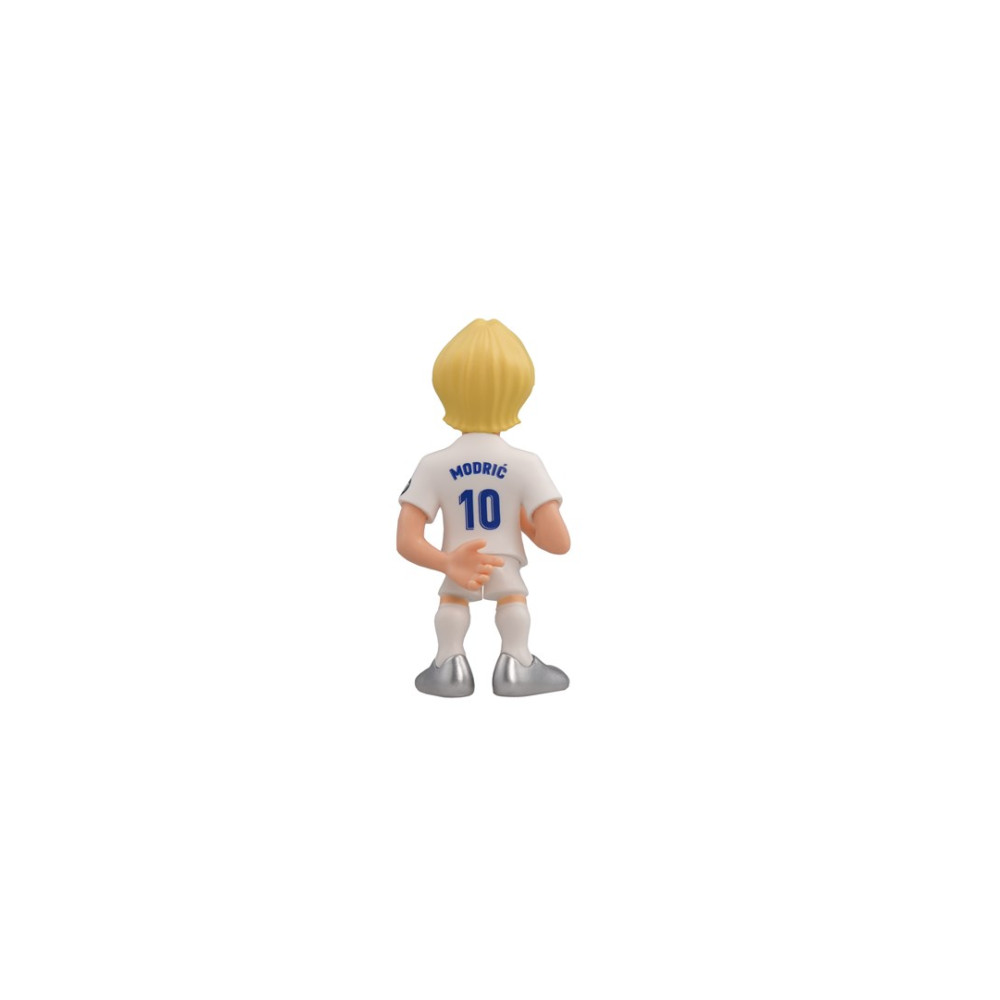 Mała figurka blond piłkarza, w białej koszulce.