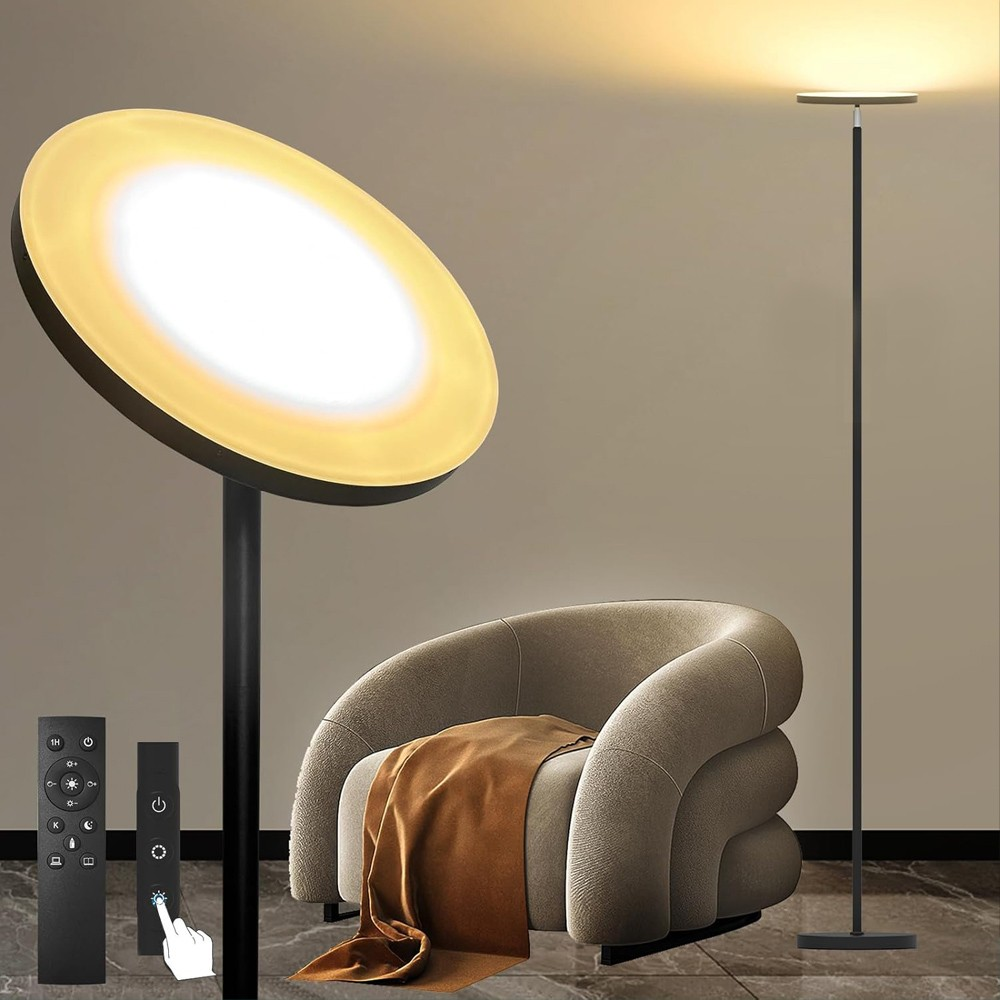Un sillón con manta, dos lámparas de pie y mandos a distancia.