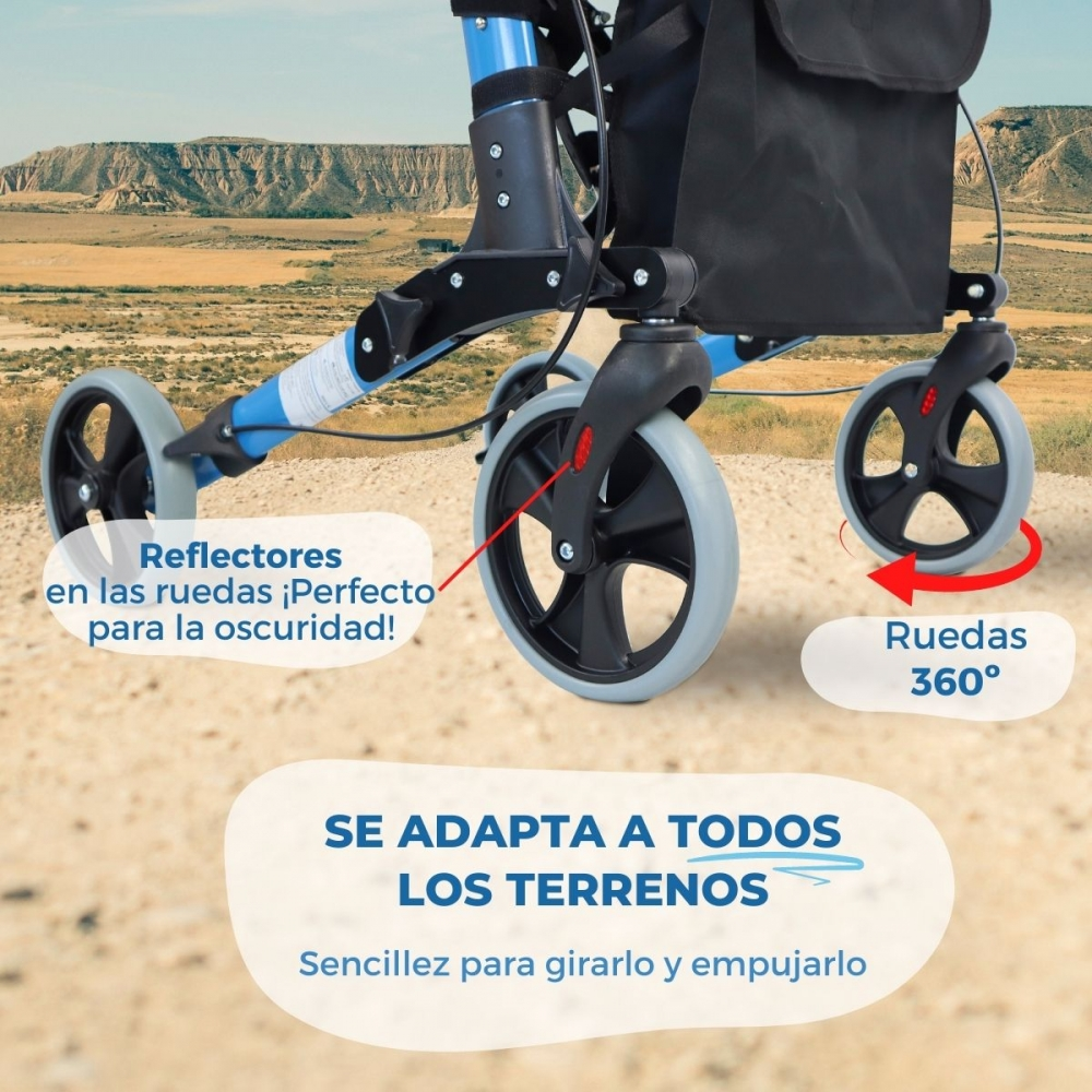 Un andador azul con reflectores en las ruedas en un paisaje desértico.