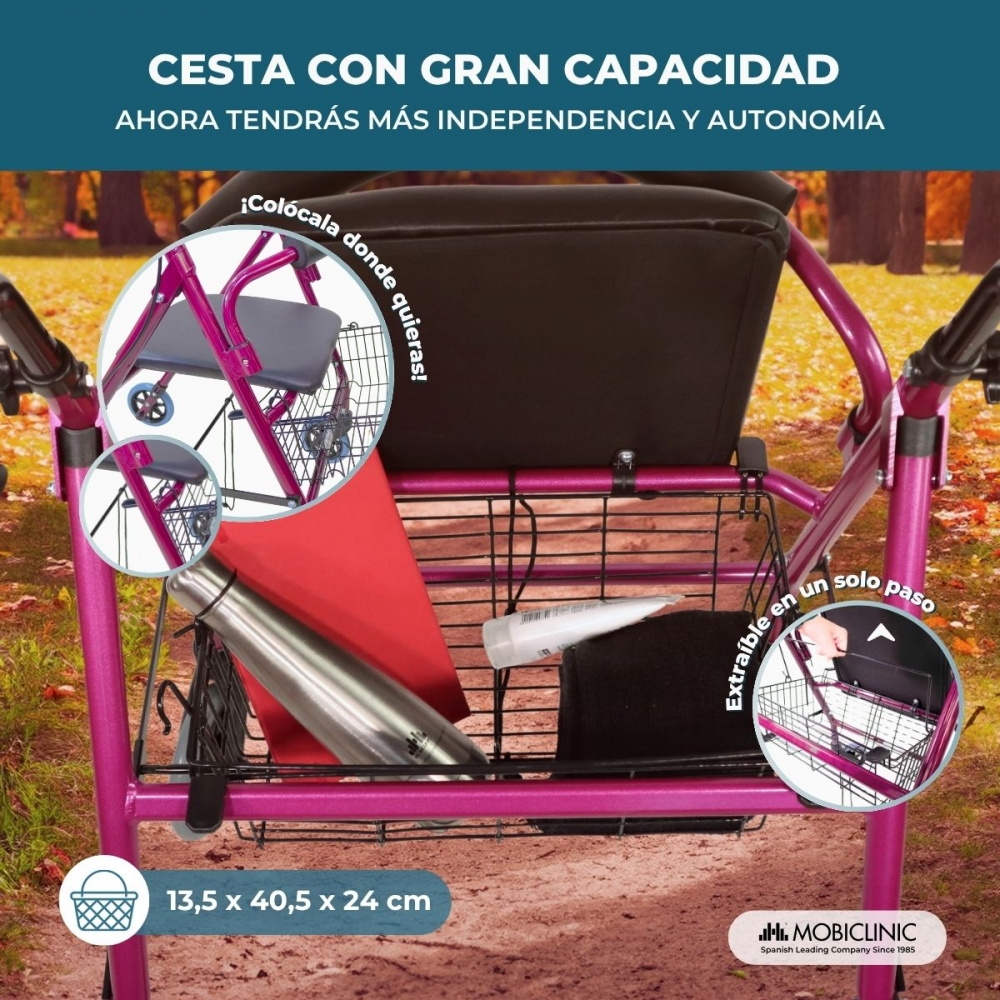 Un andador rosa con una cesta grande que contiene botella, libro y tubo.