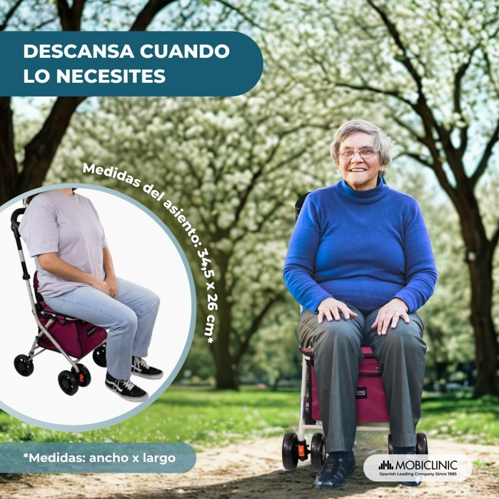 Mujer mayor sentada en un andador en un parque. Primer plano muestra las dimensiones del asiento.