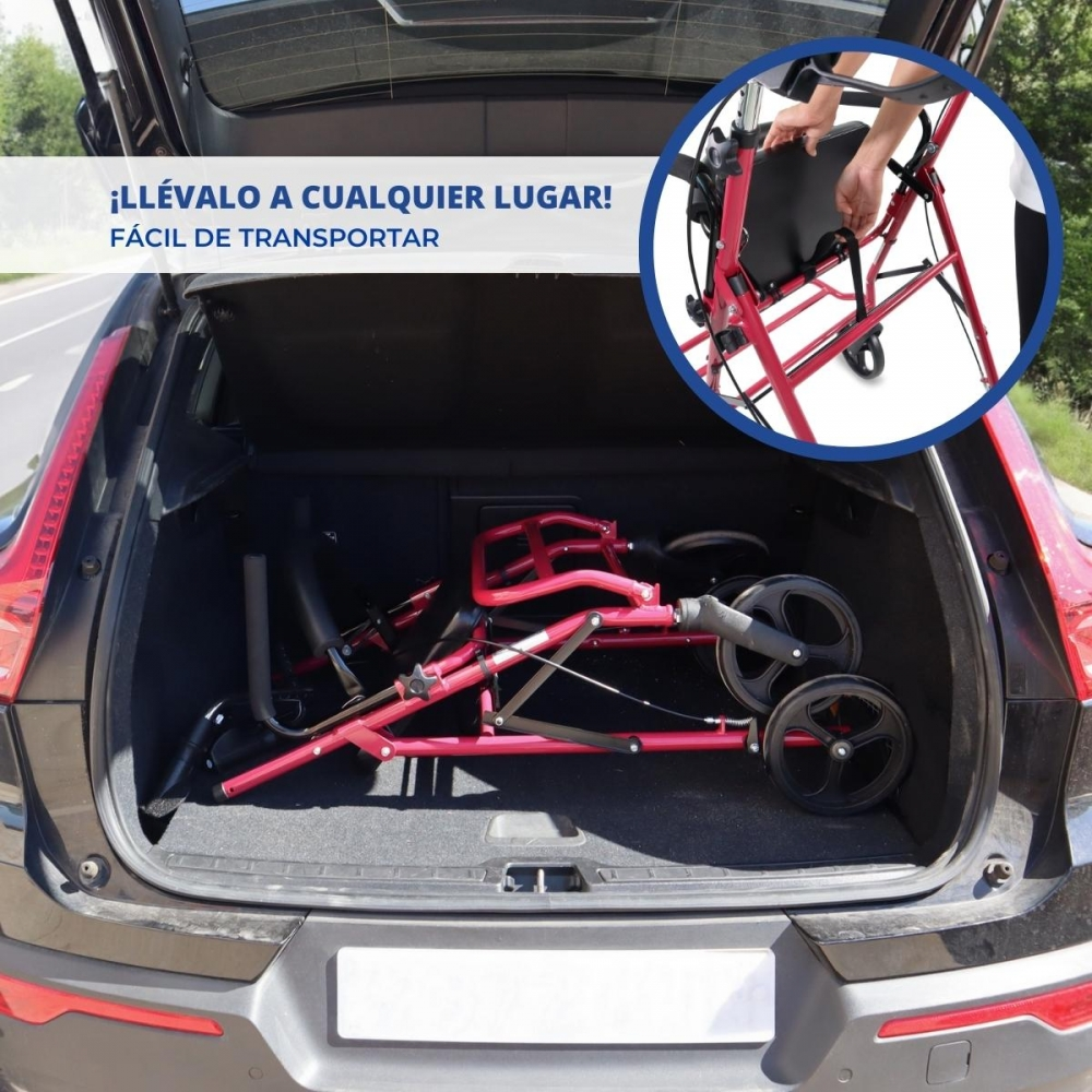 Un andador rojo plegado está guardado en el maletero de un coche.