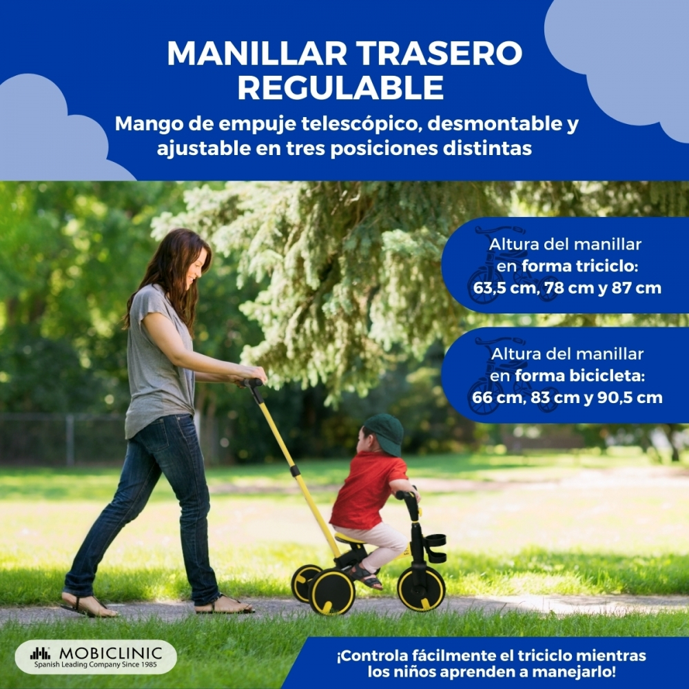 Una mujer empuja a un niño en un triciclo amarillo con manillar ajustable al aire libre.