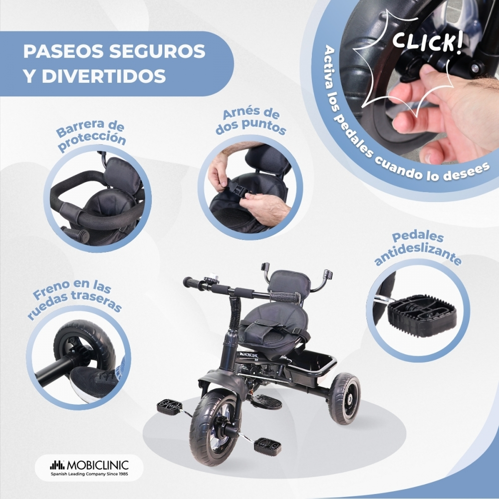 Un triciclo negro con barra de seguridad, arnés de 5 puntos y pedales antideslizantes.